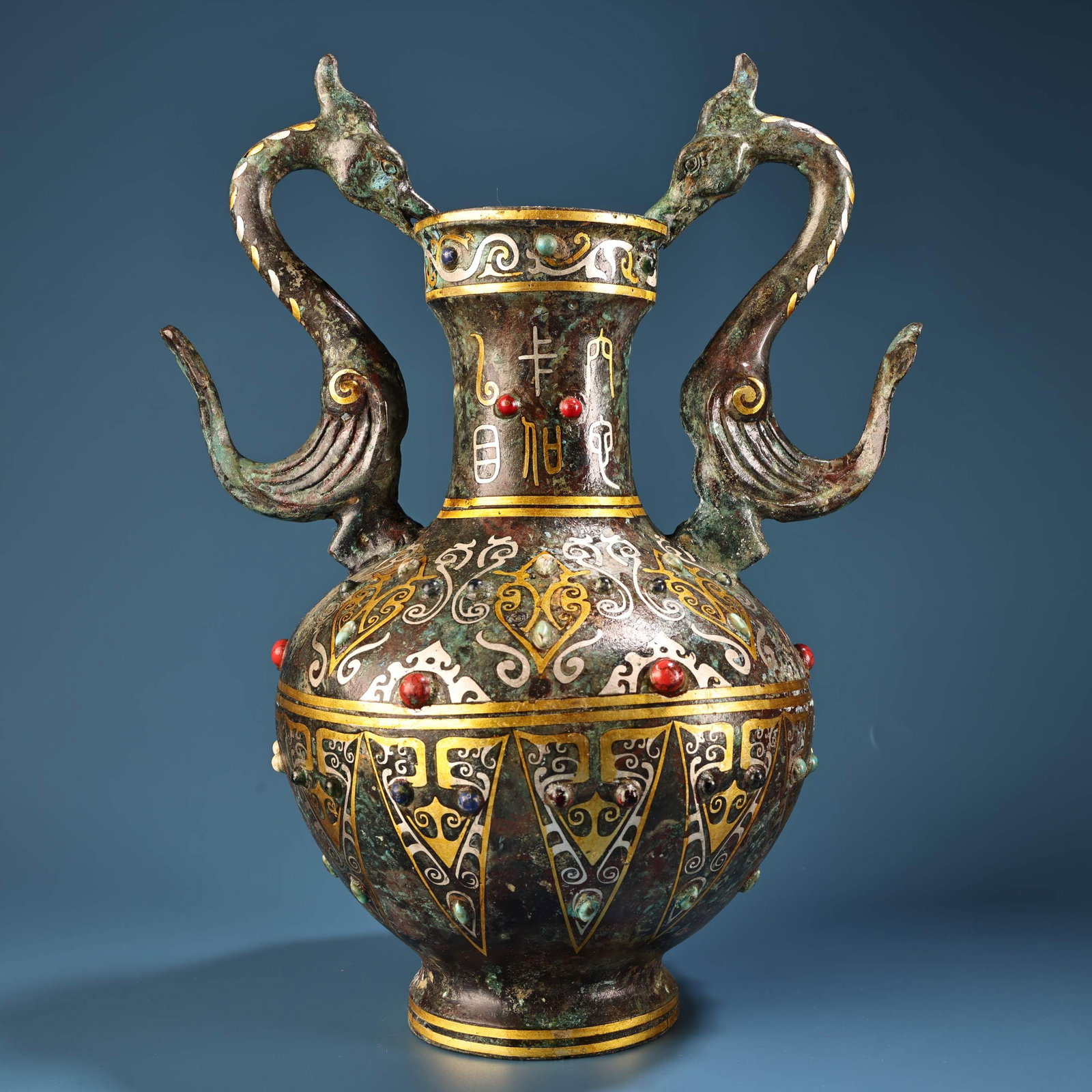 A Exquisite Gold and Silver-Inlaid Bronze Phoenix-Ears Ewer: A Exquisite Gold and Silver-Inlaid Bronze Phoenix-Ears Ewer,Han Dynasty, China,Size:10.2inx7.9in ,Weight:1600g 青铜错金凤耳壶,中国汉代