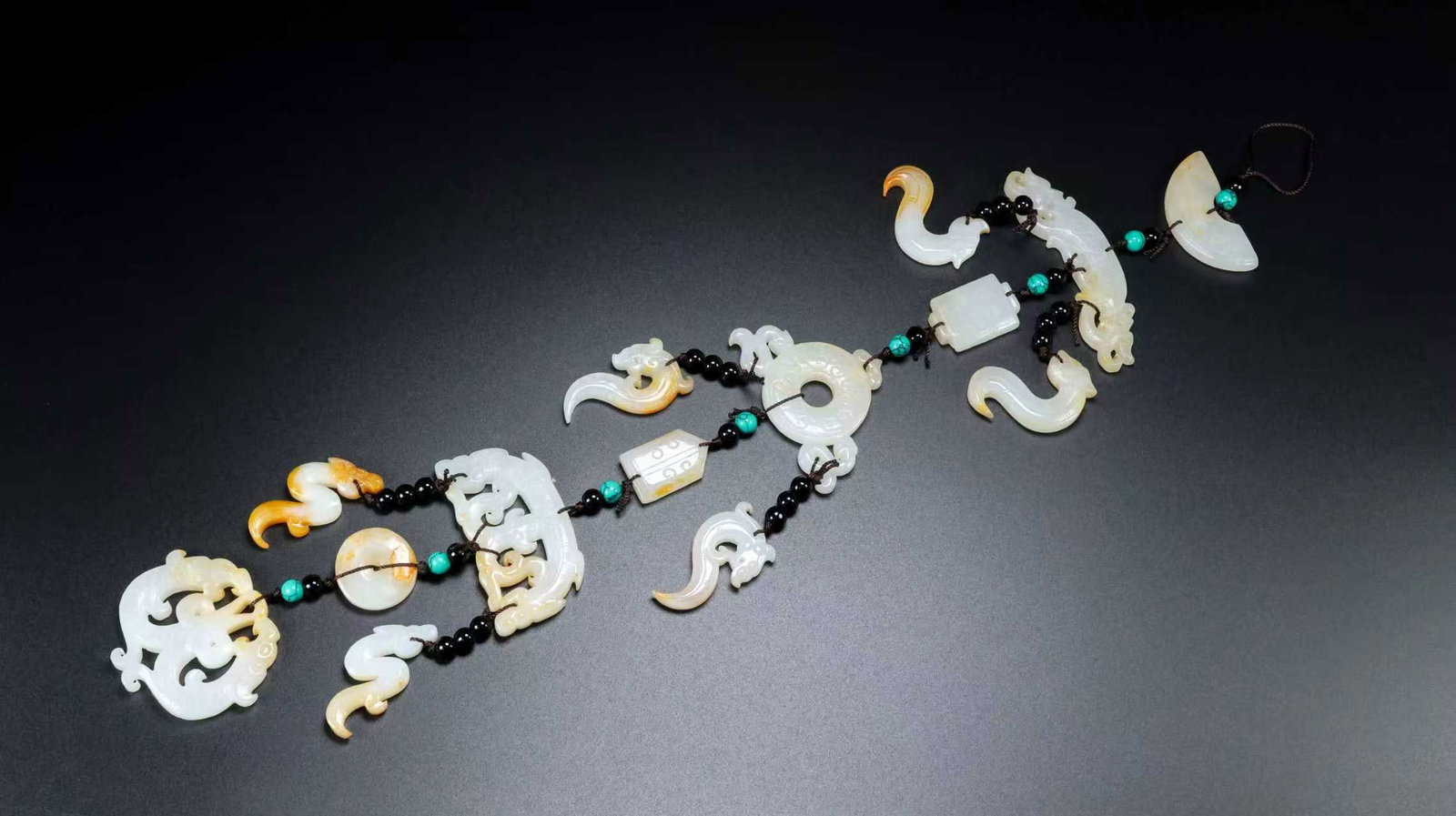 A Exquisite Hotan Jade Pendant: A Exquisite Hotan Jade Pendant,Qing Dynasty, China,Size:14.2inx2.4inx0.2in,Weight:129g 和田玉挂件,中国清代