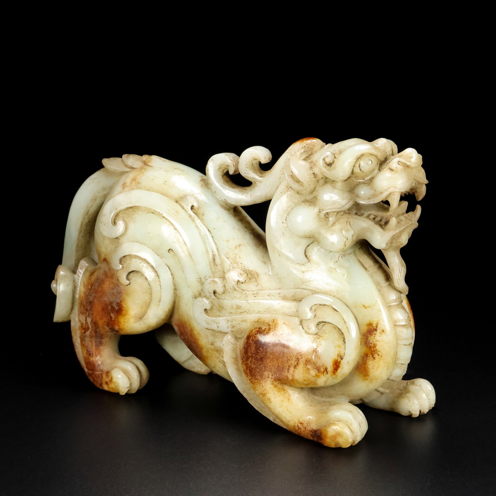 A pair of Exquisite Hotan Jade Auspicious Beast Ornaments (1 of 7)