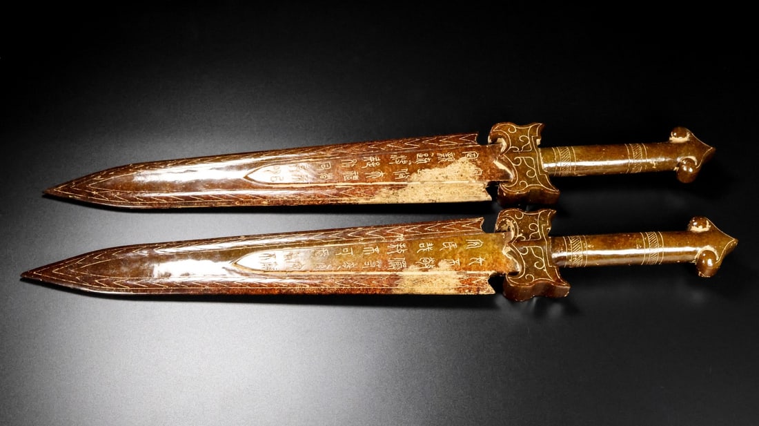 A pair of Exquisite Hotan Jade Swords: A pair of Exquisite Hotan Jade Swords,Han Dynasty, China,Size:22inx3inx1.4in,Weight:1612g 一对和田玉剑,中国汉代