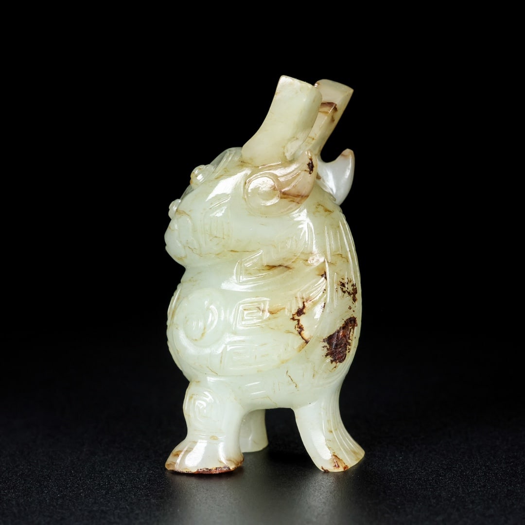 A Exquisite Hotan Jade Auspicious Beast Ornament: A Exquisite Hotan Jade Auspicious Beast Ornament,Hang Dynasty, China,Size:1.2inx1.2inx2.4in,Weight:83g 和田玉瑞兽摆件,中国汉代