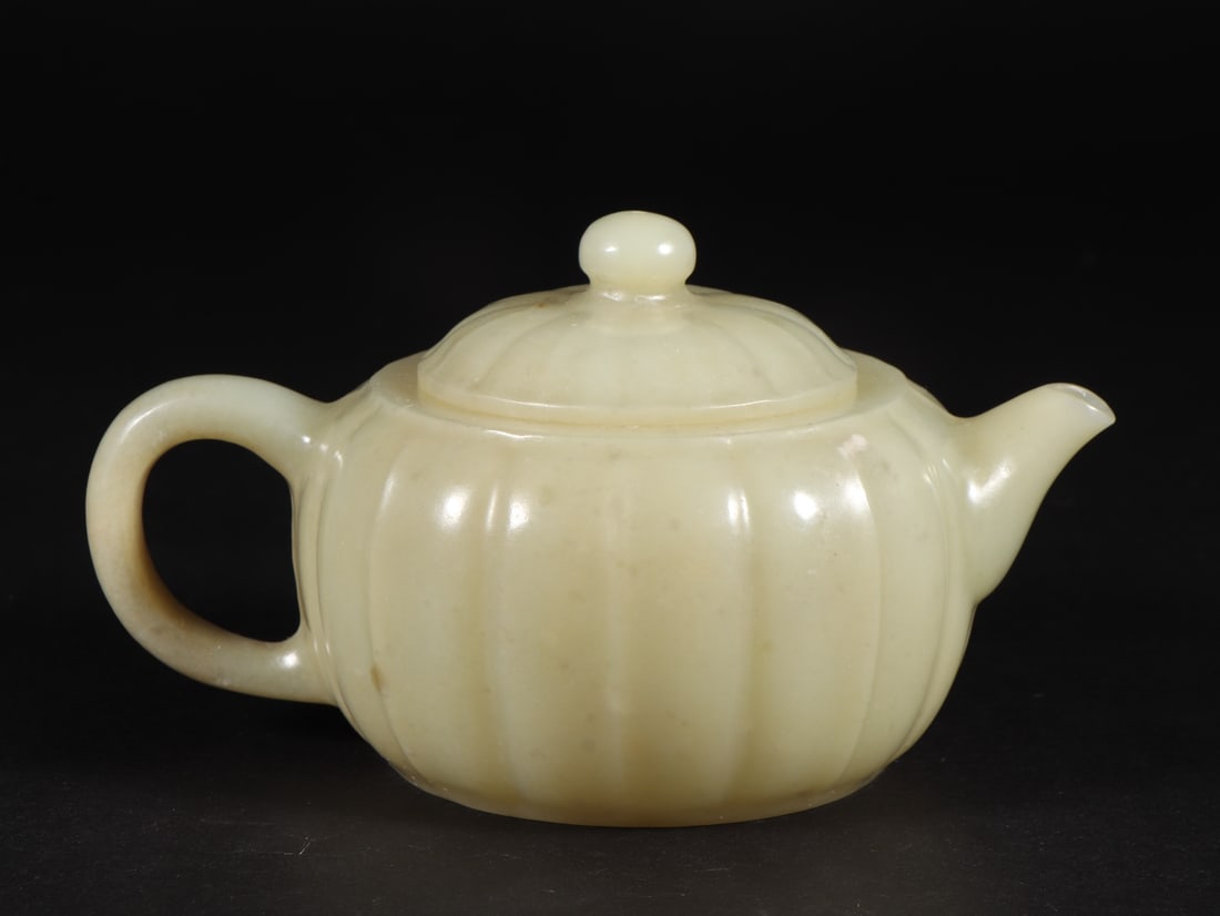 A Exquisite Hotan Jade Pumpkin-Shaped Teapot: A Exquisite Hotan Jade Pumpkin-Shaped Teapot,Qing Dynasty, China,Size:5.5inx3.7inx3in,Weight:258g 和田玉南瓜形壶,中国清代