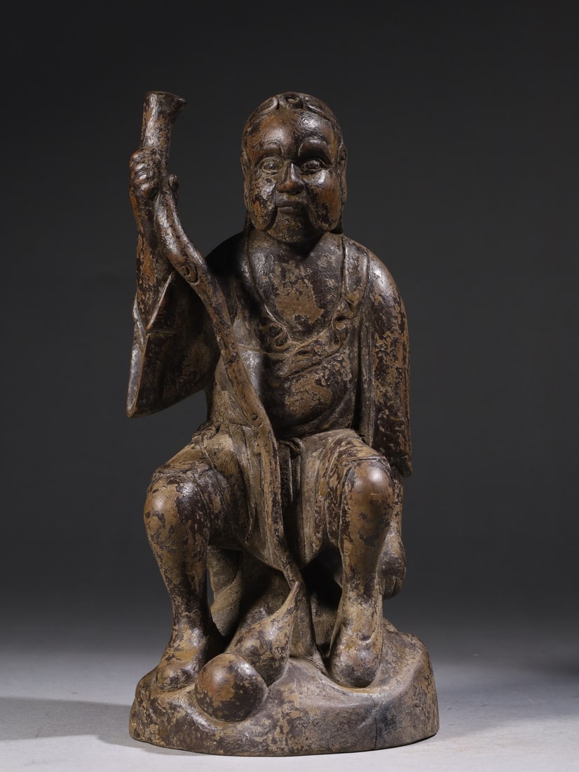 An Exquisite Boxwood Figure Ornament: An Exquisite Boxwood Figure Ornament Qing Dynasty, China Size:4.1inx3.9inx9.1in Weight:679g黄杨木铁拐李坐像 中国清代 Size:10.3cm