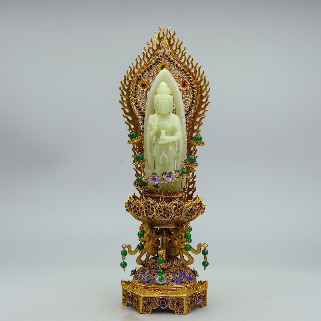 An Exquisite Gilt Bronze Inlaid White Jade Statue of Avalokitesvara Ornament: An Exquisite Gilt Bronze Inlaid White Jade Statue of Avalokitesvara Ornament Qing Dynasty, China Qianlong Four-character Mark Size:13.8inx4.5in Weight:929g铜鎏金镶嵌į