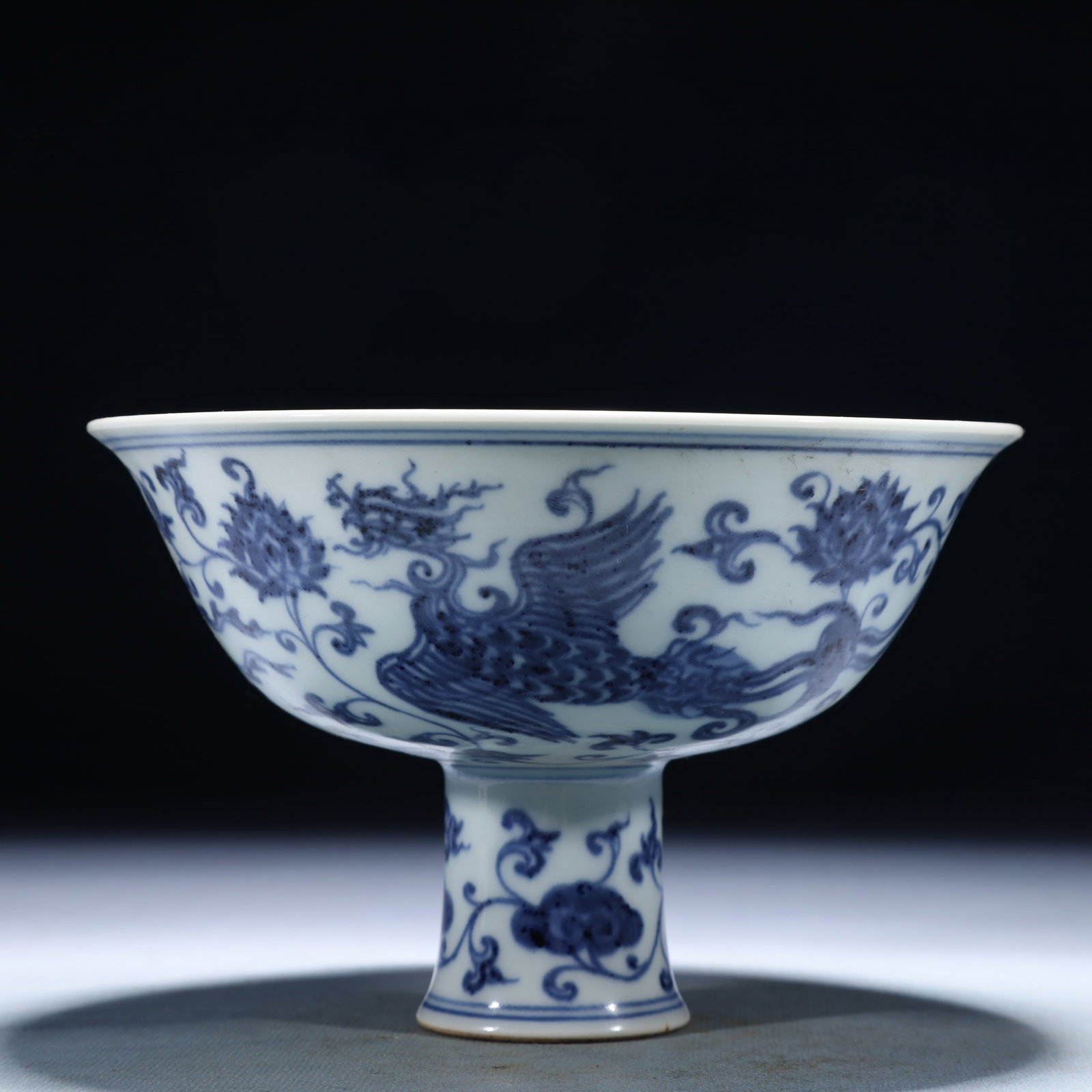 An Exquisite Blue and White Lotus and Phoenix Pattern Stem Bowl: An Exquisite Blue and White Lotus and Phoenix Pattern Stem Bowl,Ming Dynasty,China,Xuande Six-character Mark,Size:6.3inx4.1in,Weight:350g 青花缠枝莲凤纹ོ