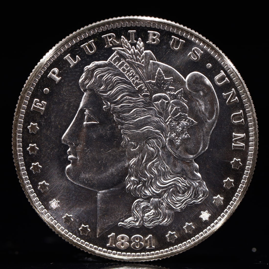 USA Morgan Dollar 1881 Coin: Obv: profile bust with date below and E PLURIBUS UNUM legend and stars around. Rev: eagle with In God we trust above within wreath with UNITED STATES OF AMERICA ONE DOLLAR legend. IN GOD WE TRUST /