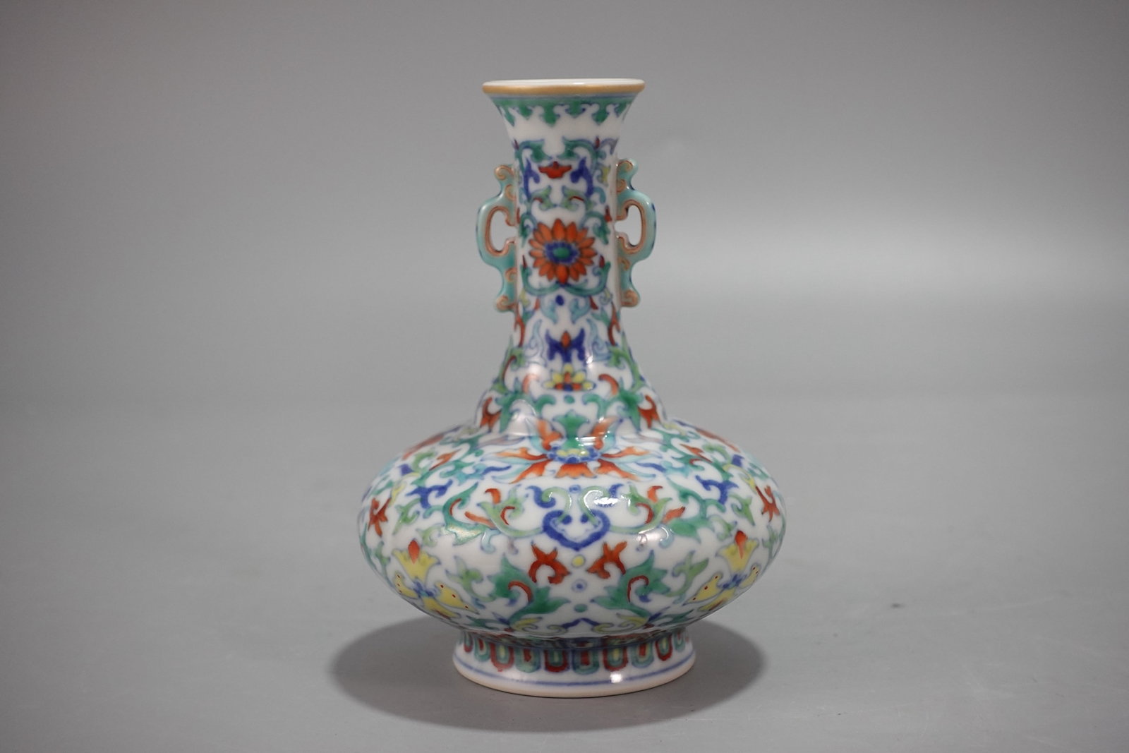 An Exquisite Doucai Lotus Pattern Double-Ears Vase: An Exquisite Doucai Lotus Pattern Double-Ears Vase,Qing Dynasty,China,Qianlong Six-character Mark,Size:4.9inx3.5in