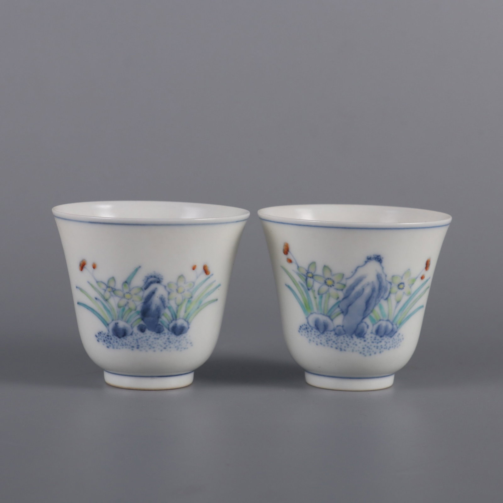A Pair of Exquisite Doucai Orchid Pattern Cups: A Pair of Exquisite Doucai Orchid Pattern Cups,Qing Dynasty,China,Tongzhi Six-character Mark,Size:2.1inx2.4in