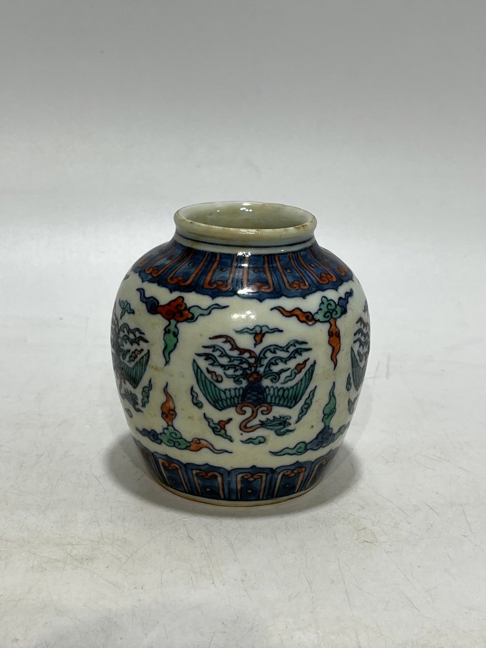An Exquisite Blue and White Wucai Auspicious Cloud and Phoenix Pattern Jar (1 of 9)