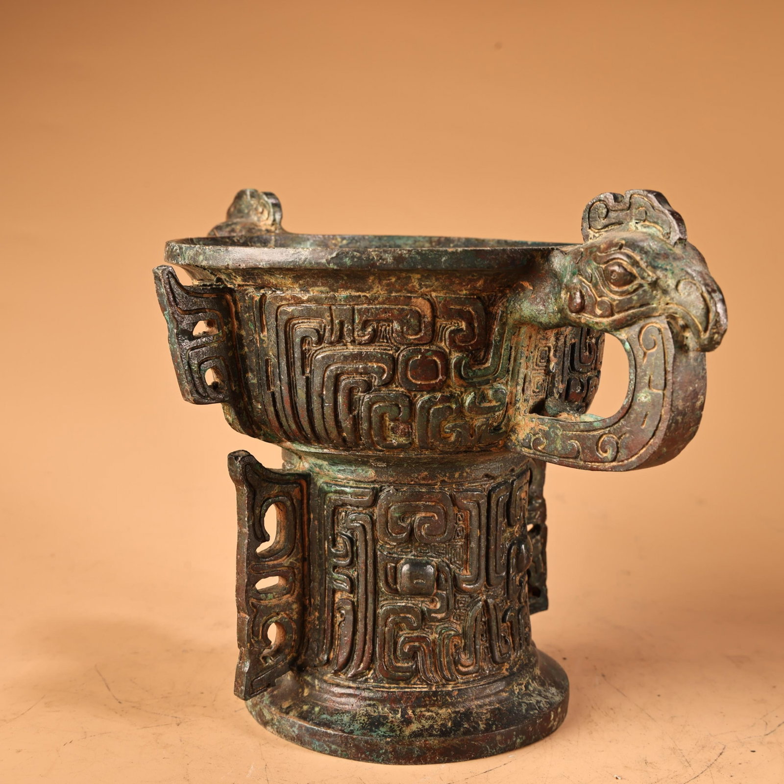 An Archaic Bronze Beast-Face Pattern Libation Cup - 3