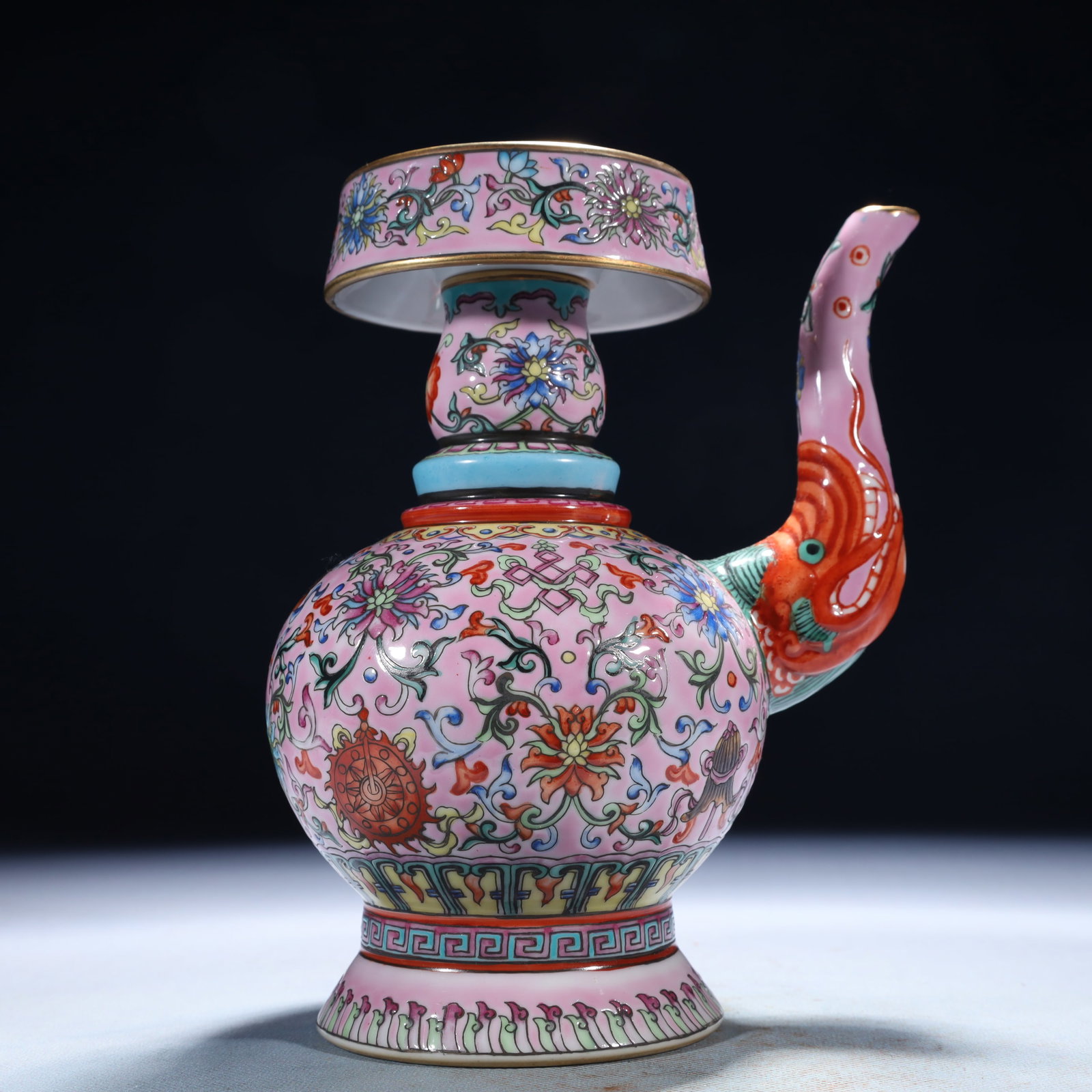 An Exquisite Famille-Rose Lotus Pattern Pot: An Exquisite Famille-Rose Lotus Pattern Pot,Qing Dynasty,China,Qianlong Six-character Mark,Size:5.9inx4.3inx7.9in,Weight:950g 粉彩缠枝莲纹壶,中国&