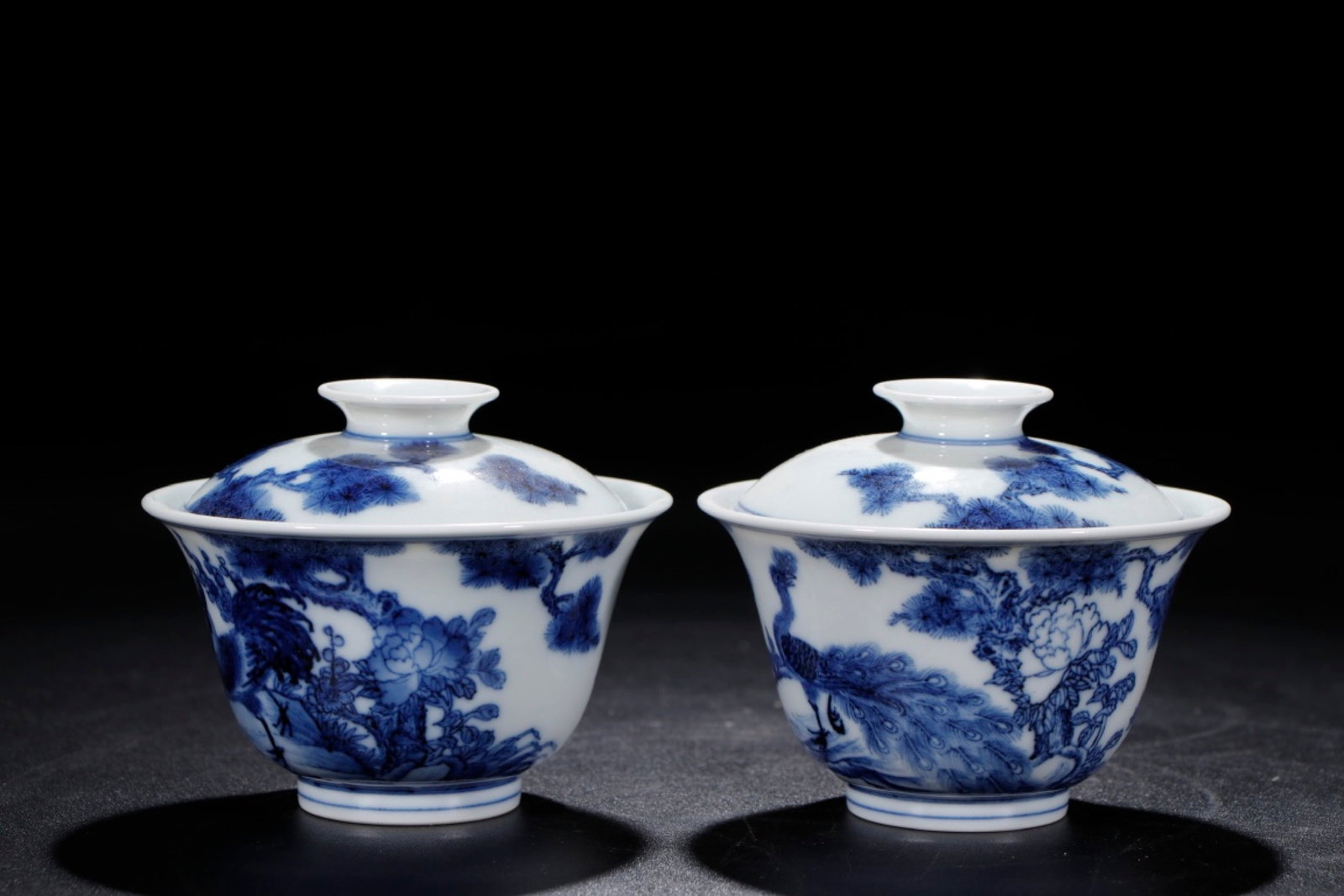 A Pair of Exquisite Blue and White Flower and Peacock Pattern Bowls: A Pair of Exquisite Blue and White Flower and Peacock Pattern Bowl,Qing Dynasty,China,Qianlong Six-character Mark,Size:3.3inx4.1ins