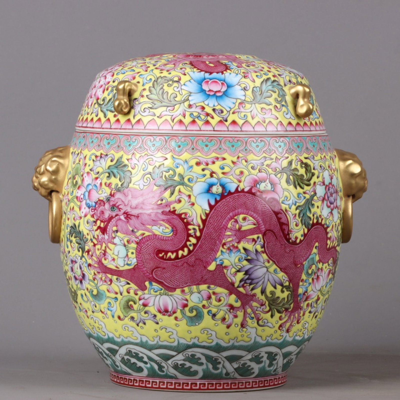 An Exquisite Enamel Gilt Lotus and Dragon Pattern Double-Ears Jar with Cover: An Exquisite Enamel Gilt Lotus and Dragon Pattern Double-Ears Jar with Cover,Qing Dynasty,China,Qianlong Six-character Mark,Size:8.7inx8.3in