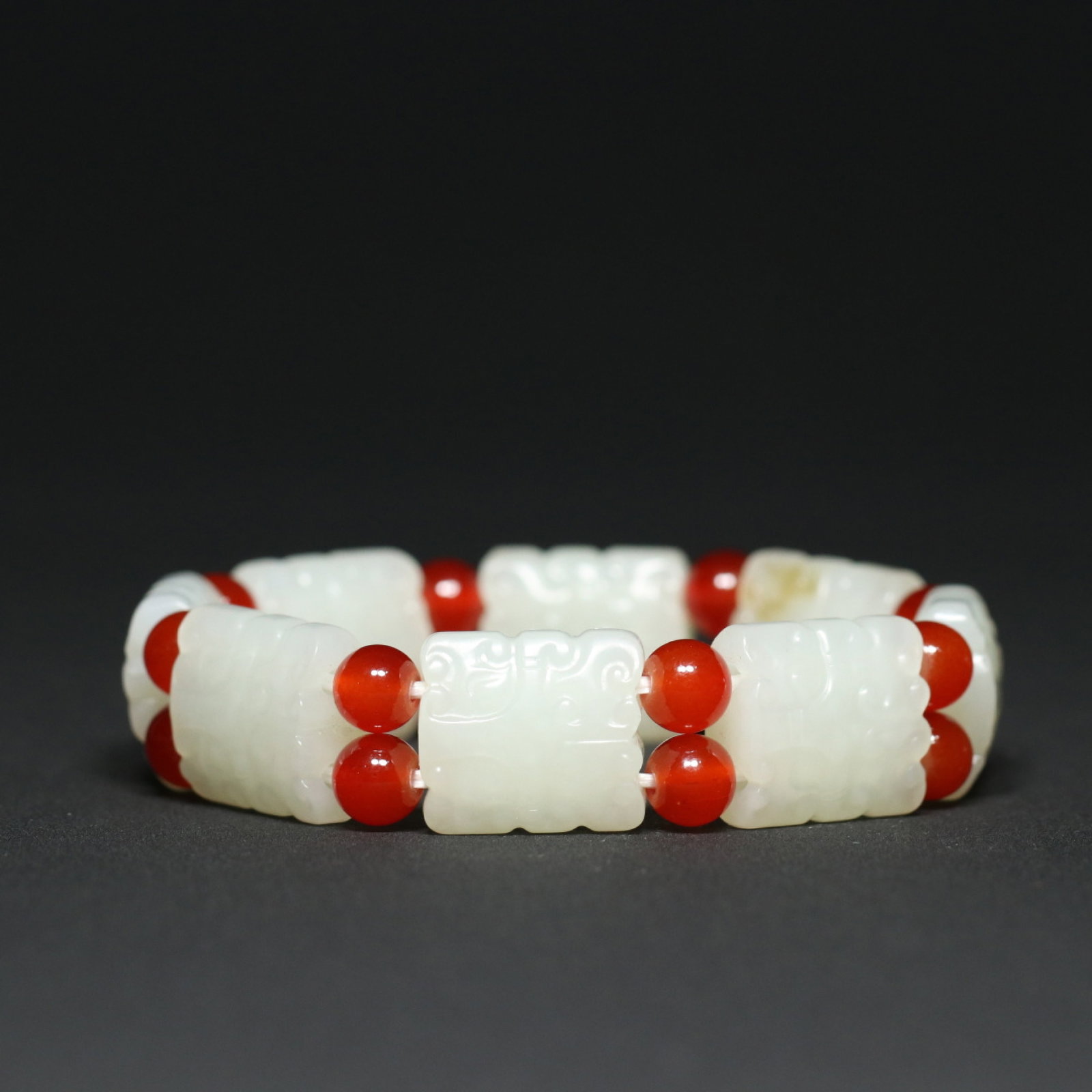 An Exquisite White Jade Beast-Face Pattern Bracelet: An Exquisite White Jade Beast-Face Pattern Bracelet,Qing Dynasty,China,Size:0.8inx0.7inx0.4in,Weight:63g 白玉兽面纹手链,中国清代