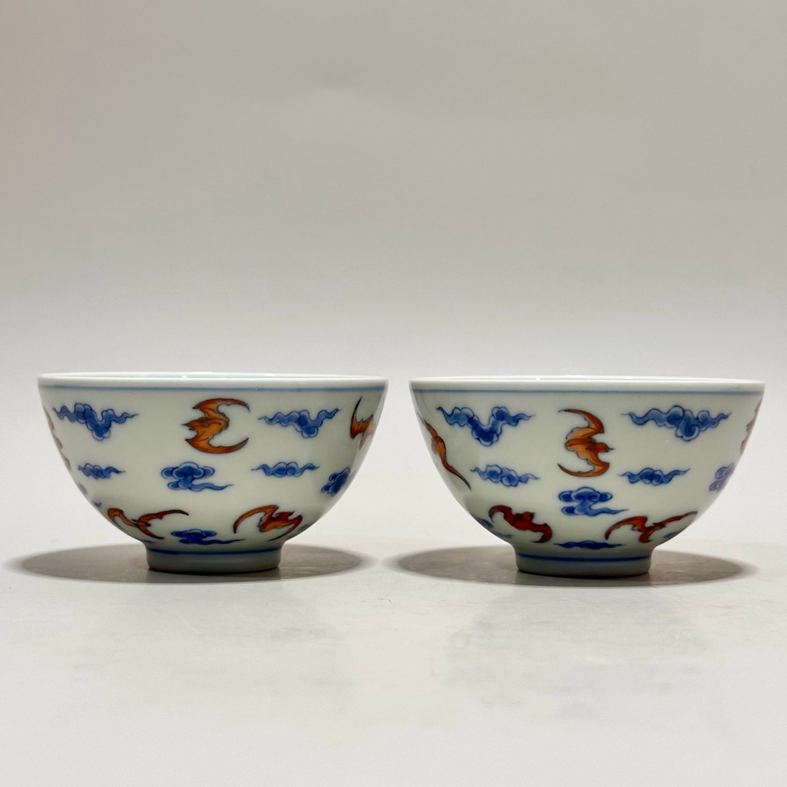 A Pair of Exquisite Doucai Auspicious Cloud and Bats Pattern Cups: A Pair of Exquisite Doucai Auspicious Cloud and Bats Pattern Cups,Qing Dynasty,China,Yongzheng Six-character Mark,Size:1.6inx3in 一对斗彩祥云蝙蝠纹