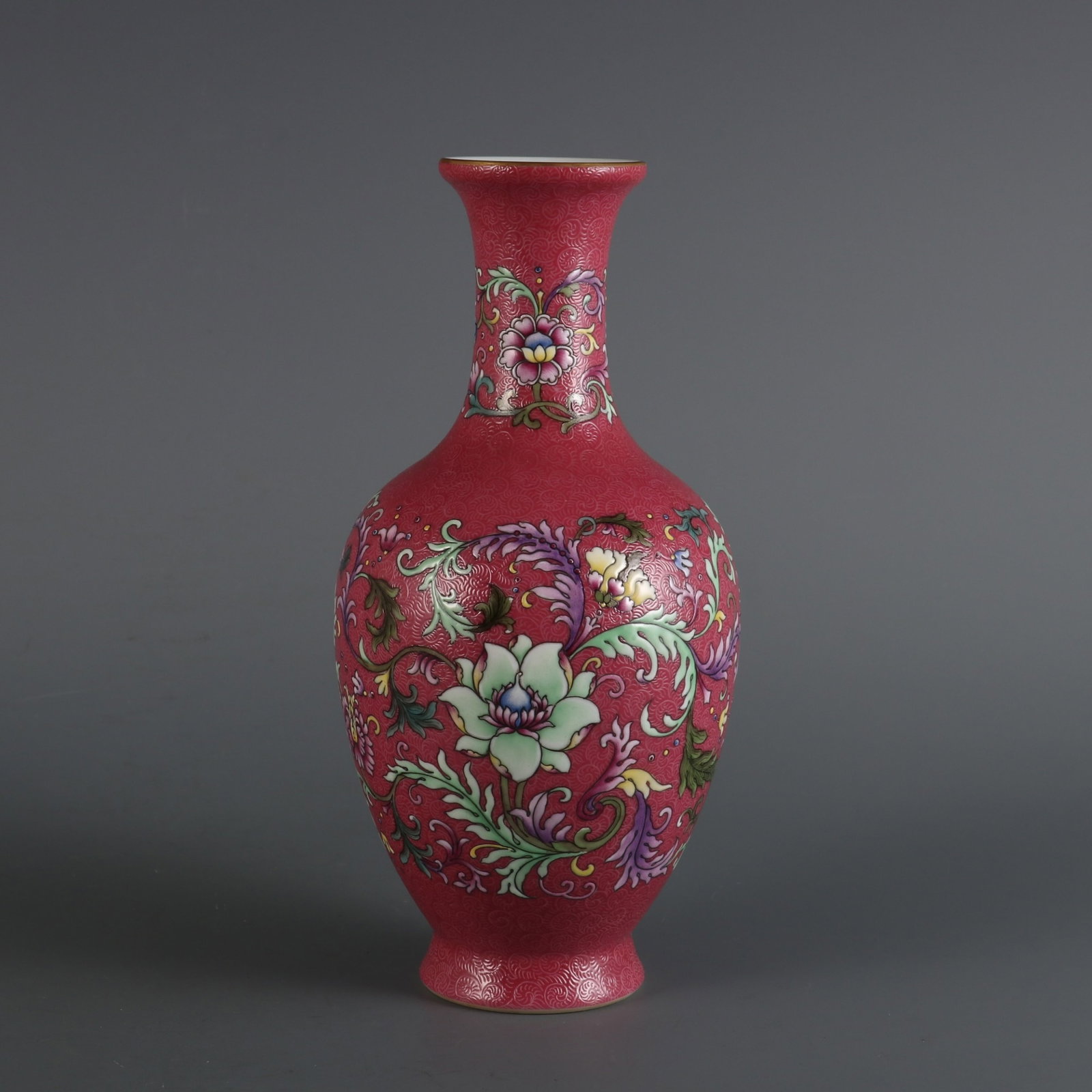 An Exquisite Ruby Red-Glazed Famille-Rose Lotus Pattern Vase: An Exquisite Ruby Red-Glazed Famille-Rose Lotus Pattern Vase,Qing Dynasty,China,Qianlong Six-character Mark,Size:8.5inx3.9in 胭脂红粉彩缠枝莲纹
