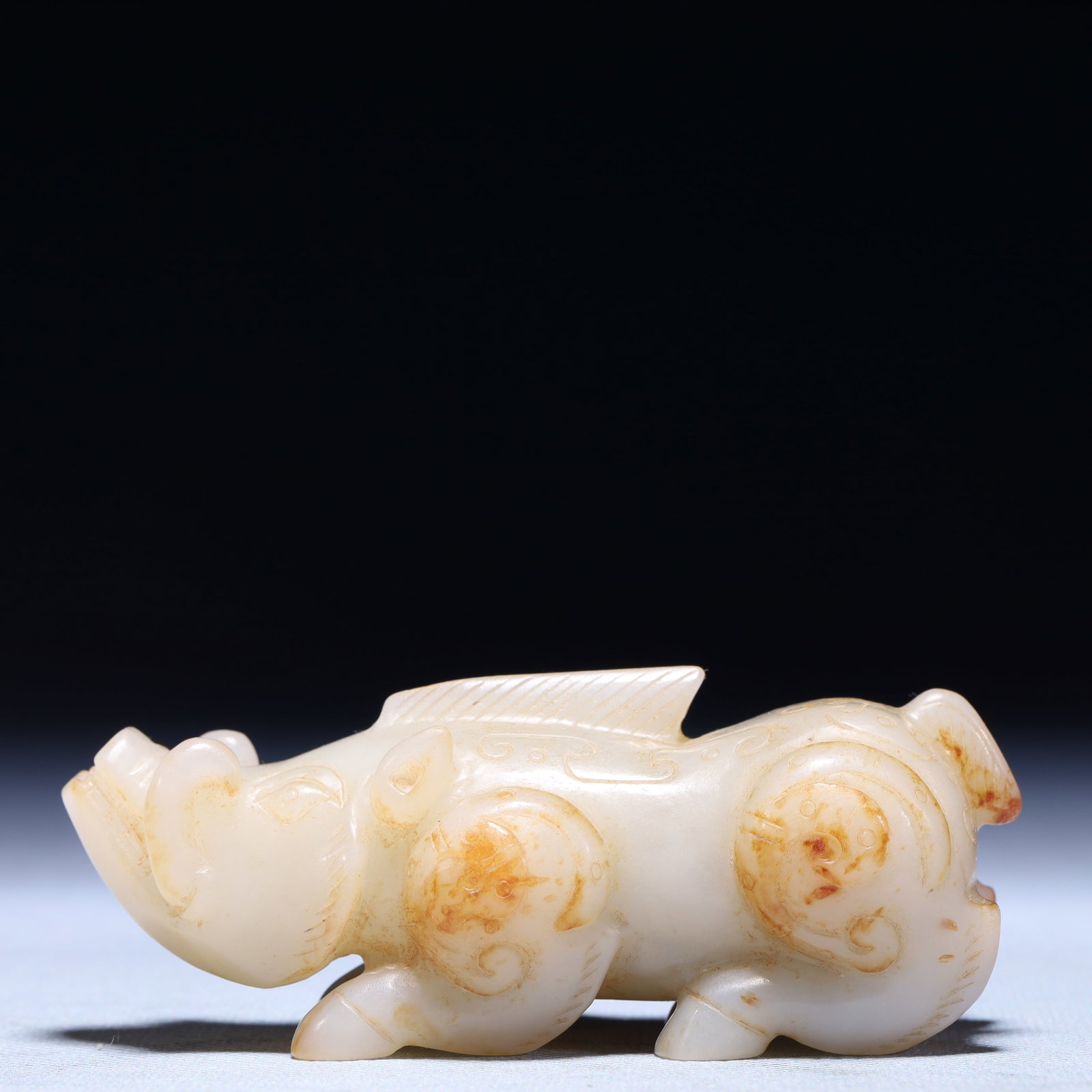 An Exquisite White Jade Rhinoceros Ornament: An Exquisite White Jade Rhinoceros Ornament,Qing Dynasty,China,Size:3.9inx1.4inx1.8in,Weight:245.2g 白玉犀牛摆件,中国清代