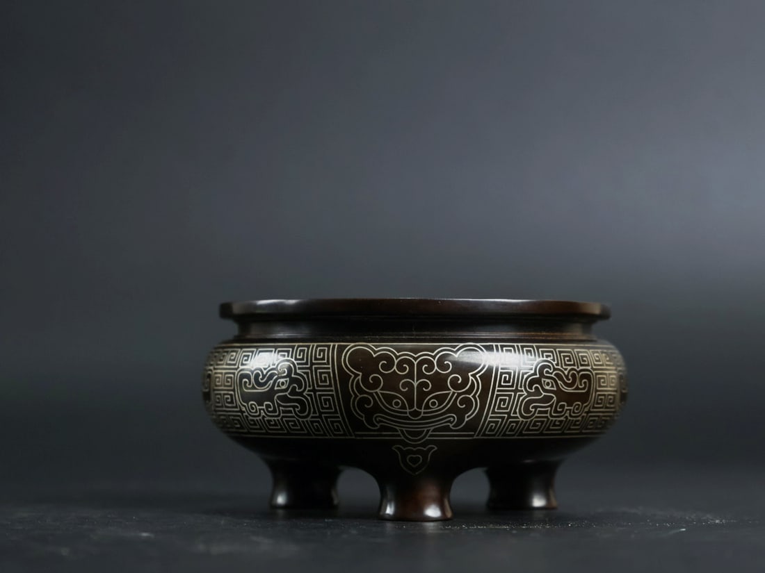 An Exquisite Bronze Inlaid Silver Beast-Face Pattern Tripod Censer: An Exquisite Bronze Inlaid Silver Beast-Face Pattern Tripod Censer,Qing Dynasty, China, With Mark,Size:1.4inx3.1in,Weight:500g