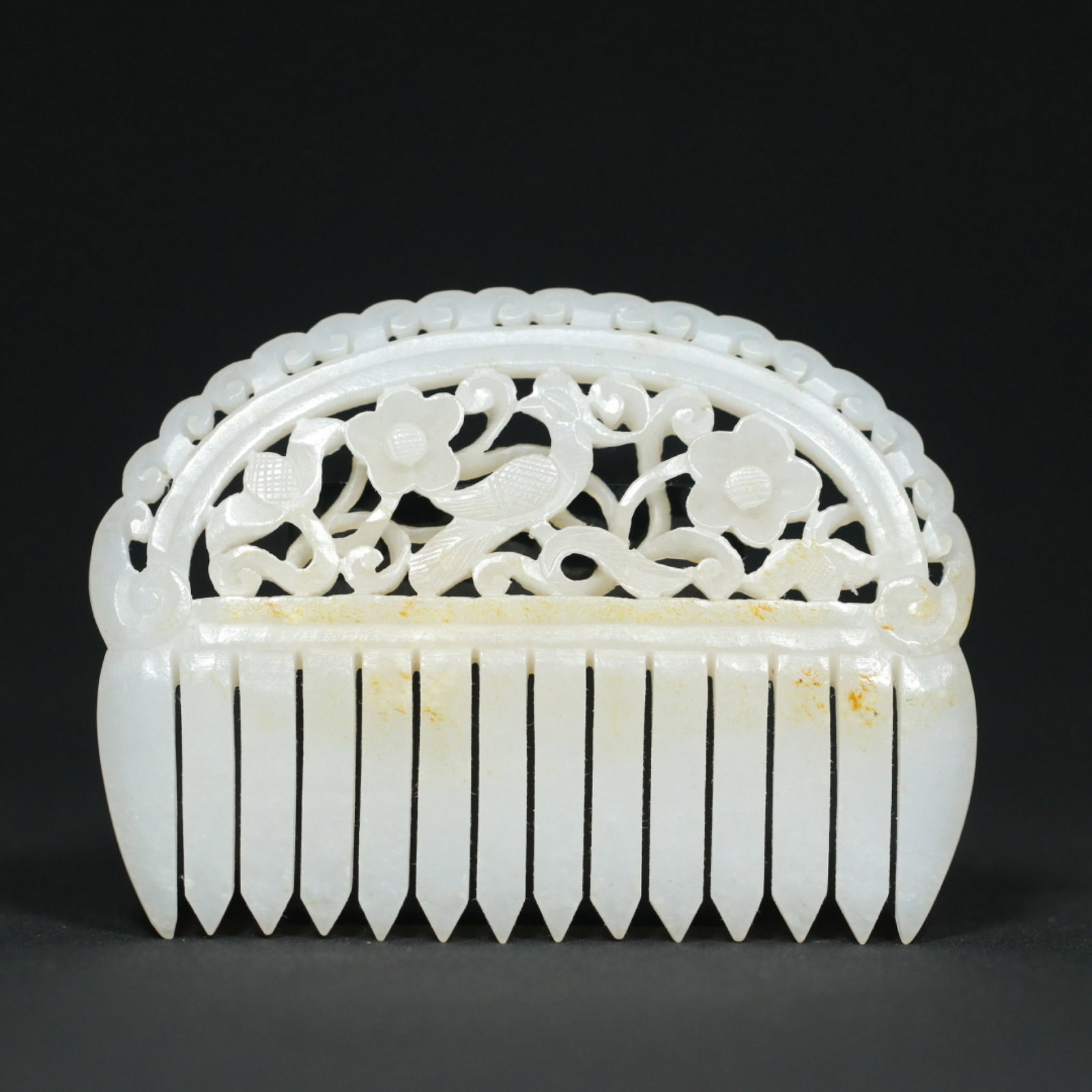 An Exquisite White Jade Hollow Flower and Bird Pattern Comb: An Exquisite White Jade Hollow Flower and Bird Pattern Comb,Qing Dynasty,China,Size:3.1inx2.3inx0.2in,Weight:39.5g 白玉镂空花鸟纹梳子,中