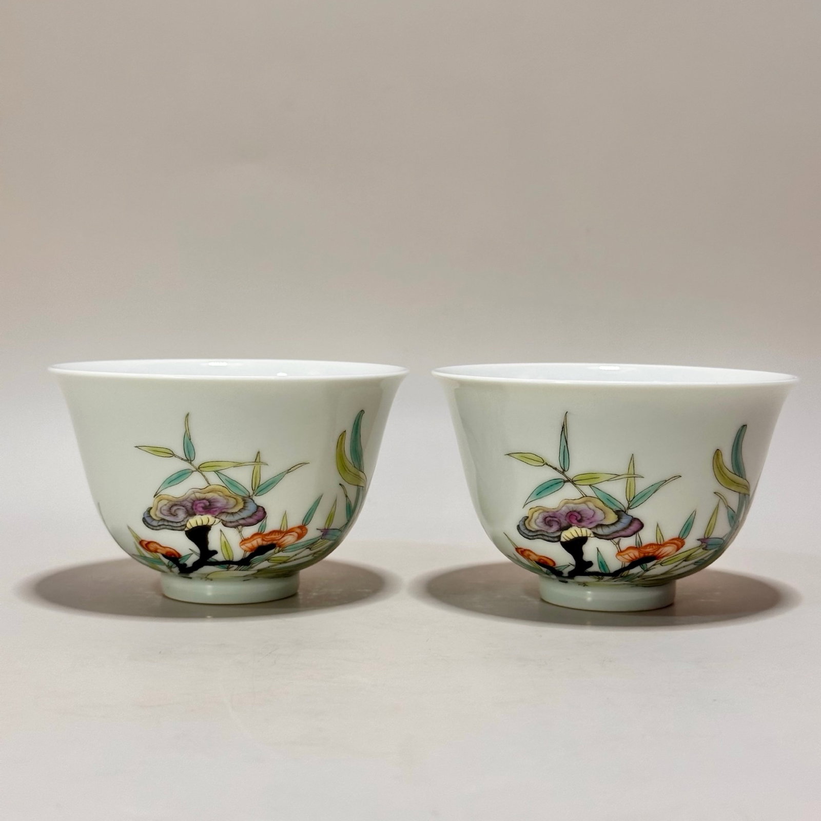 A Pair of Exquisite Famille-Rose Ganoderma lucidum Pattern Cups: A Pair of Exquisite Famille-Rose Ganoderma lucidum Pattern Cups,Qing Dynasty,China,Yongzheng Six-character Mark,Size:2.3inx3.6in 一对粉彩灵芝纹杯子