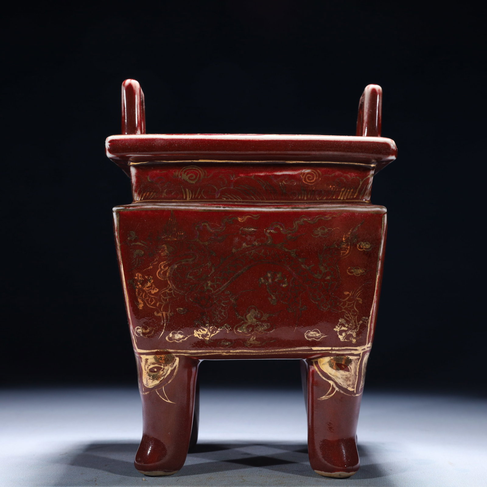 An Exquisite Red Glazed Painted Gold Auspicious Cloud and Dragon Pattern Double-Ears Censer: An Exquisite Red Glazed Painted Gold Auspicious Cloud and Dragon Pattern Double-Ears Censer,Ming Dynasty,China,Xuande Six-character Mark,Size:9.1inx7.1in,Weight:2150g 红釉描金&