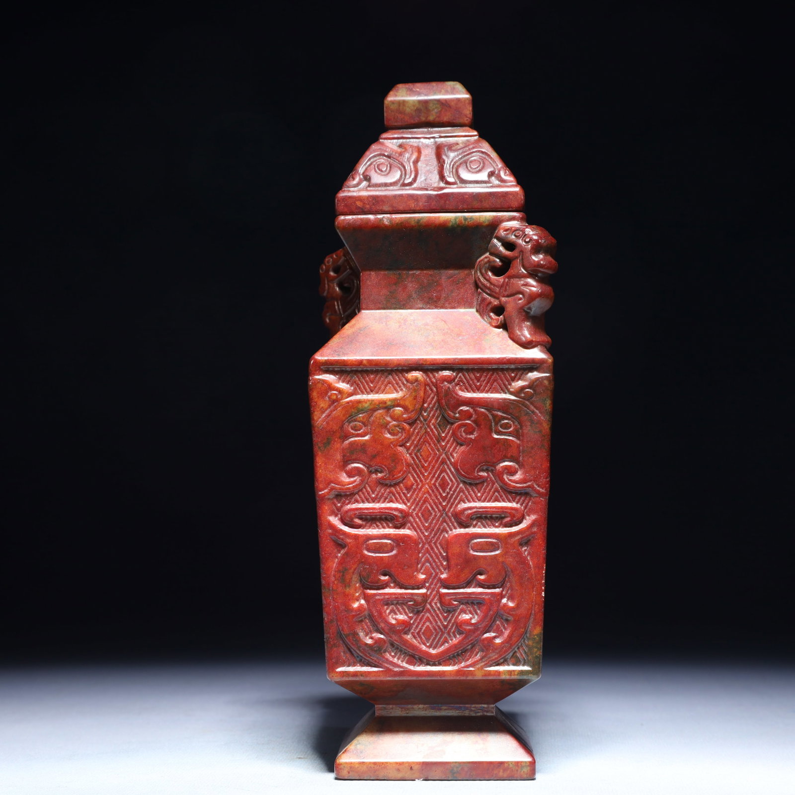 An Exquisite Archaic Jade Beast-Face Pattern Double-Ears Bottle (1 of 8)
