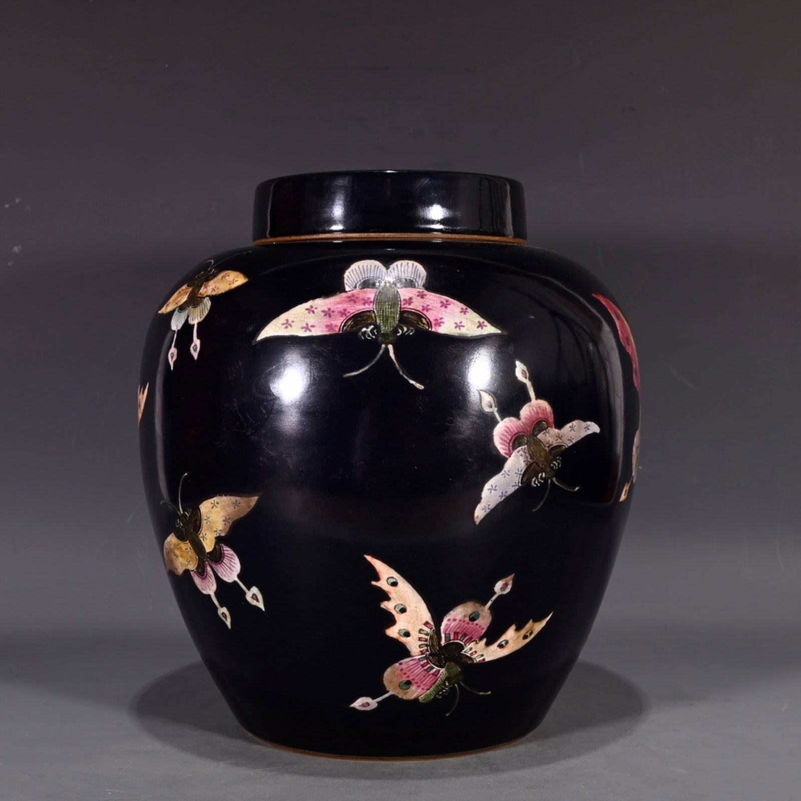 An Exquisite Black Ground Famille-Rose Butterfly Pattern Jar with Cover: An Exquisite Black Ground Famille-Rose Butterfly Pattern Jar with Cover,Qing Dynasty,China,Size:9.4inx8.3in