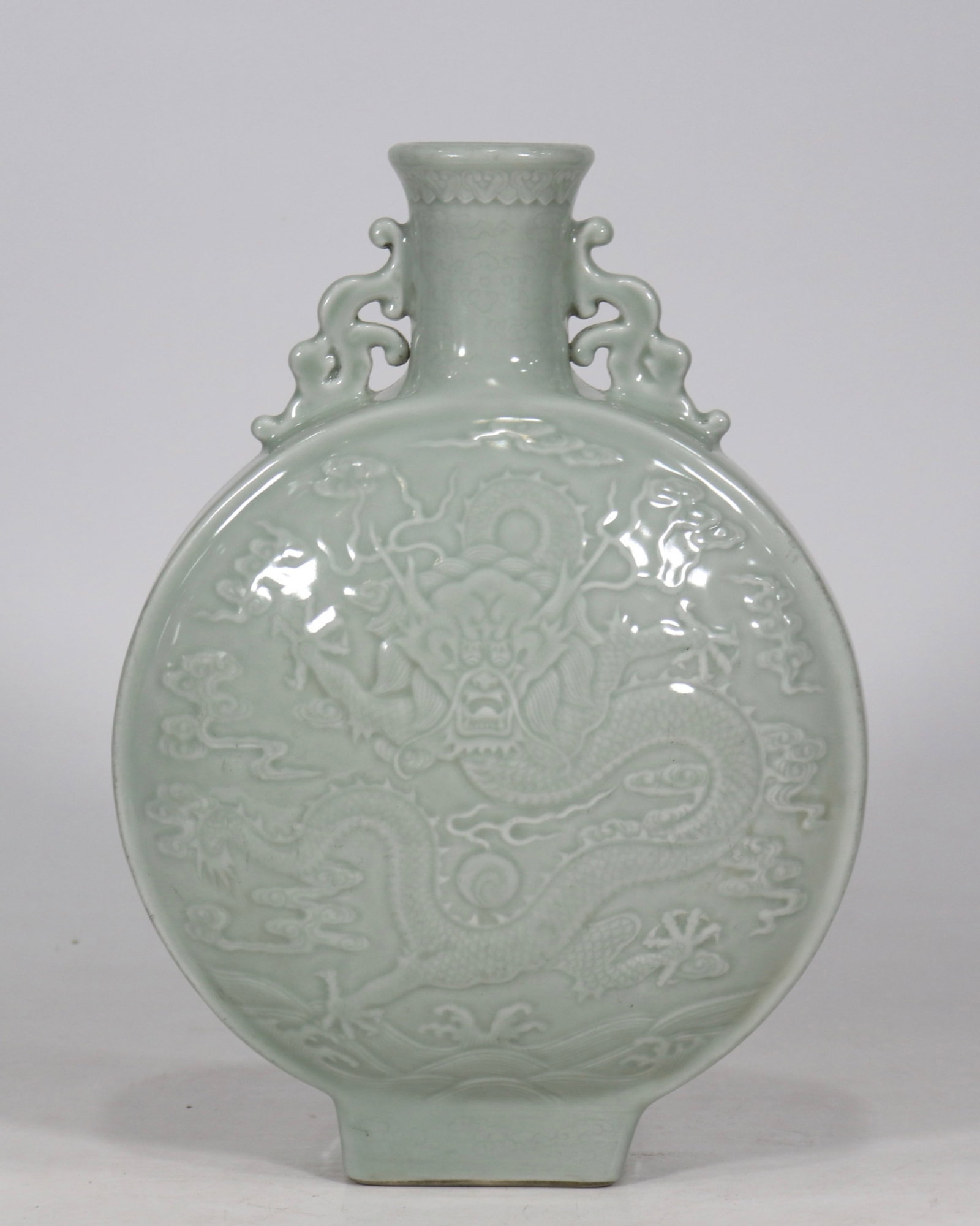 A Rare Celadon Glazed Auspicious Cloud and Dragon Pattern Double-Ears Vase: A Rare Celadon Glazed Auspicious Cloud and Dragon Pattern Double-Ears Vase,Qing Dynasty,China,Qianlong Six-character Mark,Size:12.4inx8.9in 豆青釉祥云龙纹