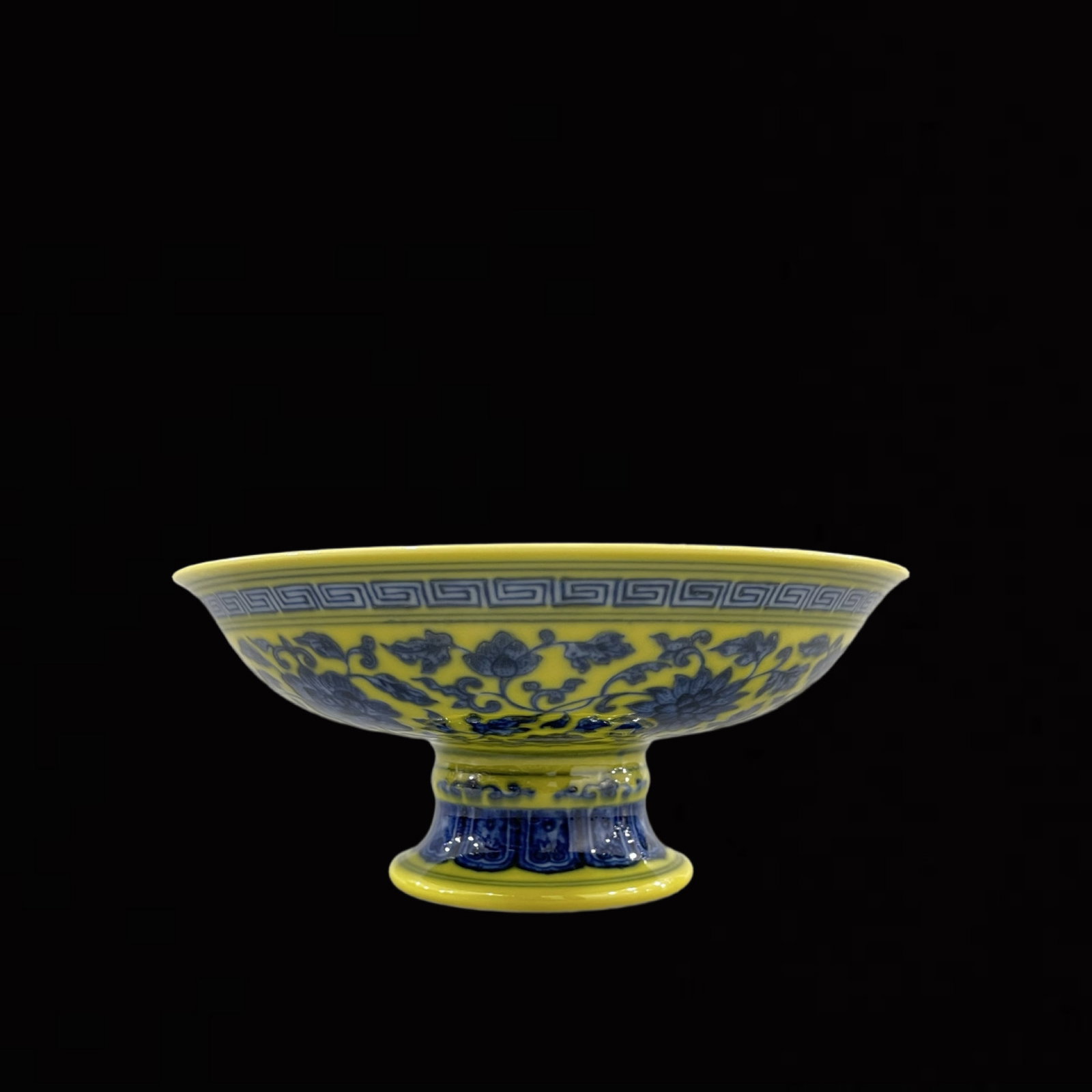 An Exquisite Yellow Ground Blue and White Lotus Pattern Stem Plate: An Exquisite Yellow Ground Blue and White Lotus Pattern Stem Plate,Qing Dynasty,China,Qianlong Six-character Mark,Size:2.8inx6.7in 黄地青花缠枝莲纹ƌ