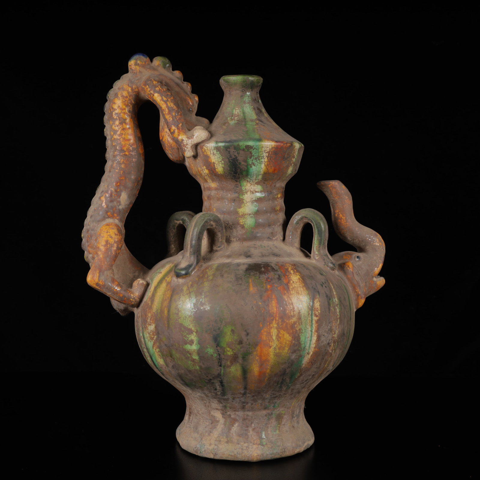 An Exquisite Tang Tri-Color Glazed PotteryDragon and Elephant Pattern Ewer: An Exquisite Tang Tri-Color Glazed PotteryDragon and Elephant Pattern Ewer,Tang Dynasty,China,Size:11.8inx9.4inx6.7in,Weight:1550g 唐三彩龙象纹执壶,