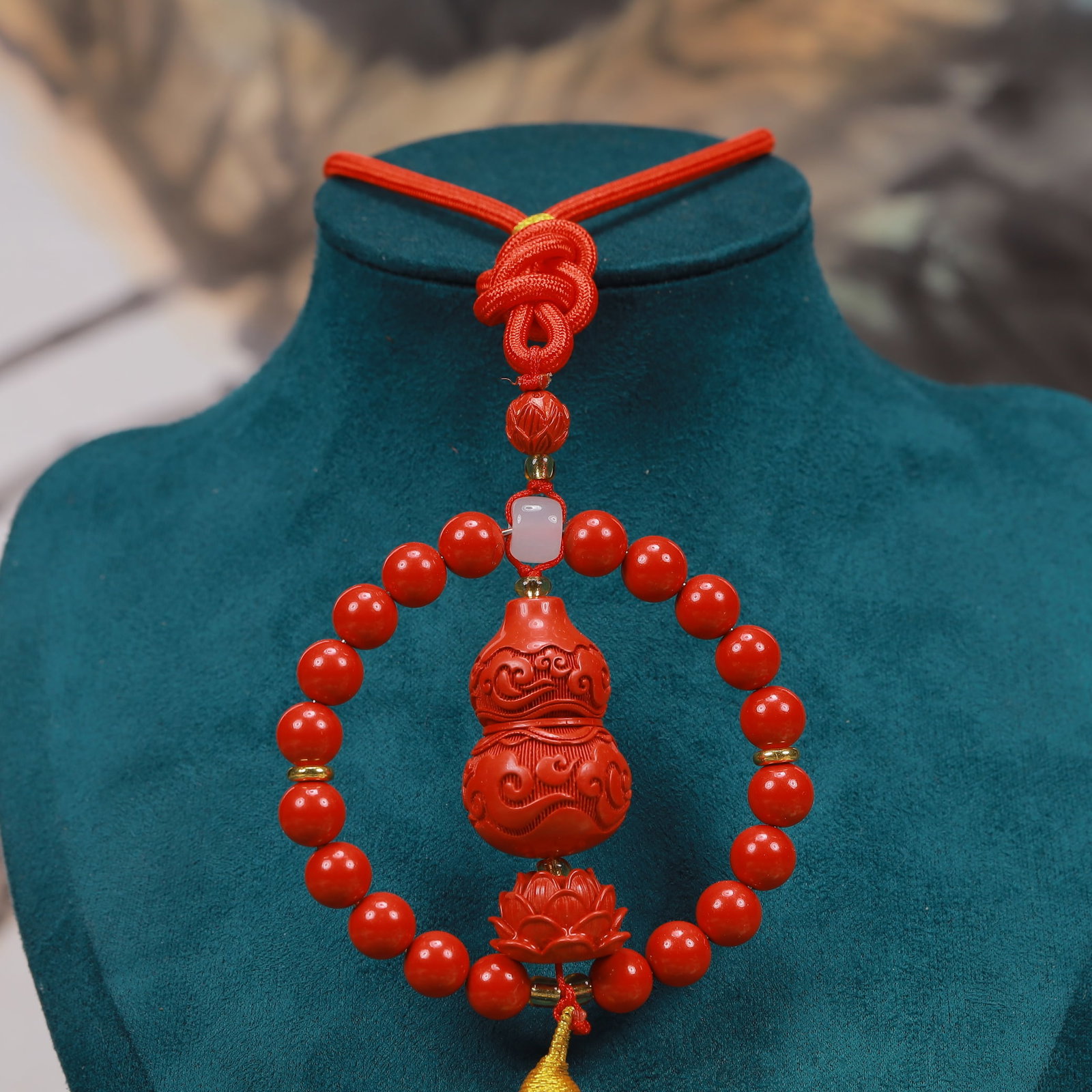 An Exquisite Cinnabar Gourd-Shaped Pendant: An Exquisite Cinnabar Gourd-Shaped Pendant, Size:2.6inx2.6in, Weight:53g 朱砂葫芦形挂件