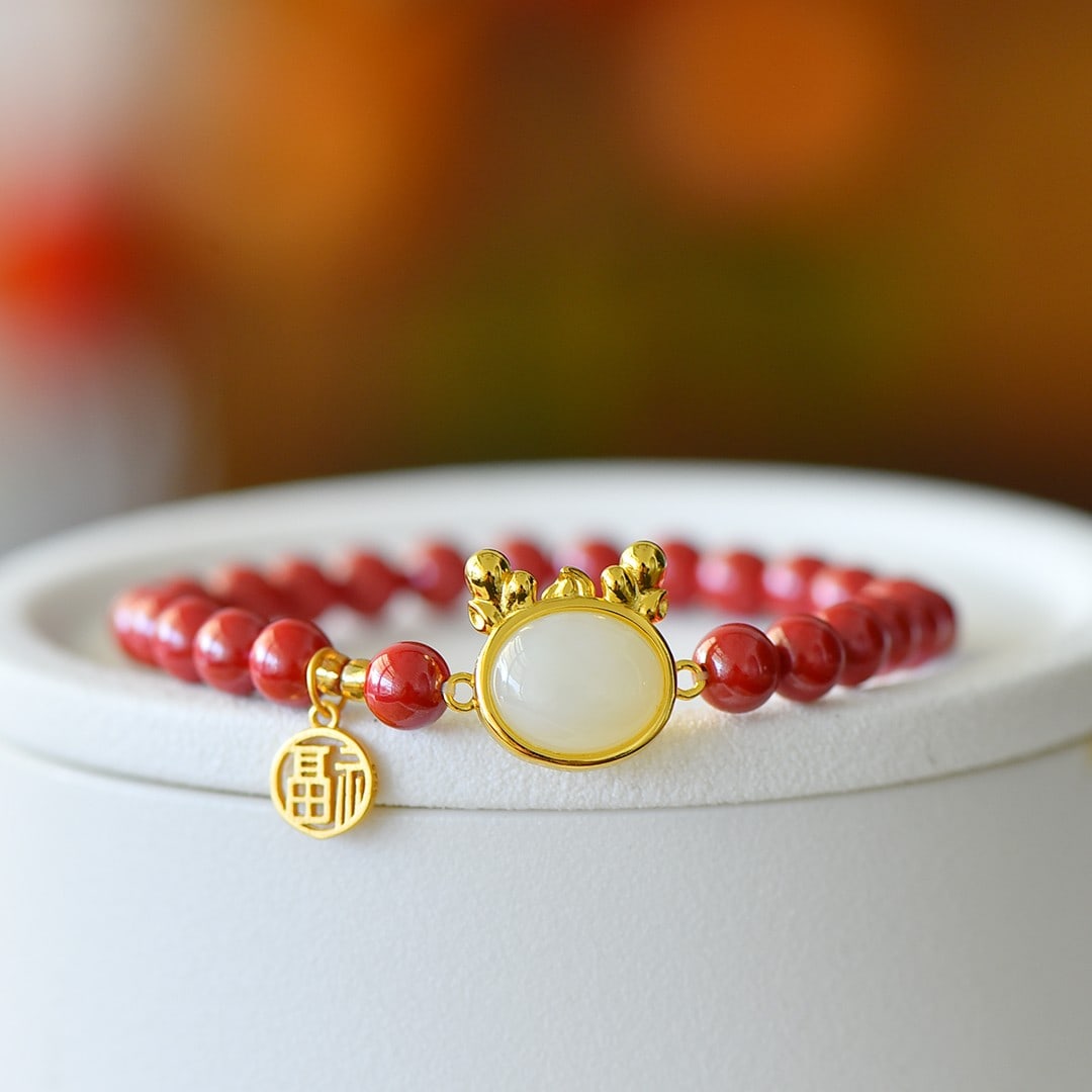An Exquisite Sterling Silver-Gold Plated Inlaid Cinnabar Bracelet,Inlaid White Jade: An Exquisite Sterling Silver-Gold Plated Inlaid Cinnabar Bracelet,Inlaid White Jade 纯银镀金镶朱砂手链,嵌白玉
