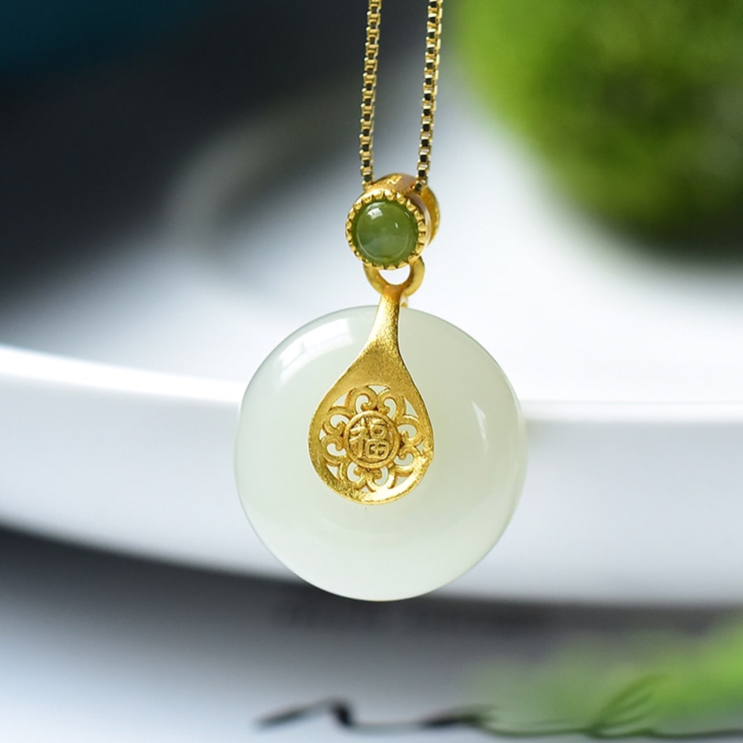 An Exquisite Sterling Silver-Gold Plated Inlaid White Jade Pendant: An Exquisite Sterling Silver-Gold Plated Inlaid White Jade Pendant 纯银镀金镶白玉吊坠