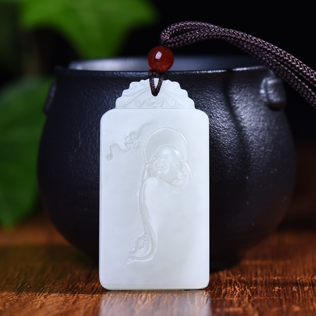 An Exquisite White Jade Buddha Pattern Pendant (1 of 5)