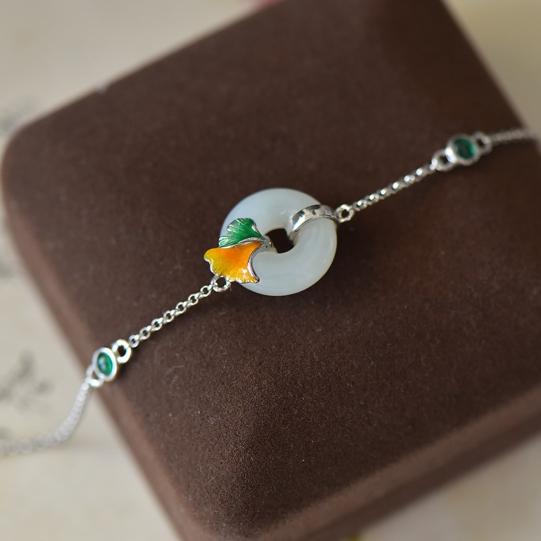 An Exquisite Sterling Silver Inlaid White Jade Enamel Bracelet: An Exquisite Sterling Silver Inlaid White Jade Enamel Bracelet,Size:0.6inx0.6in 纯银镶白玉珐琅手链