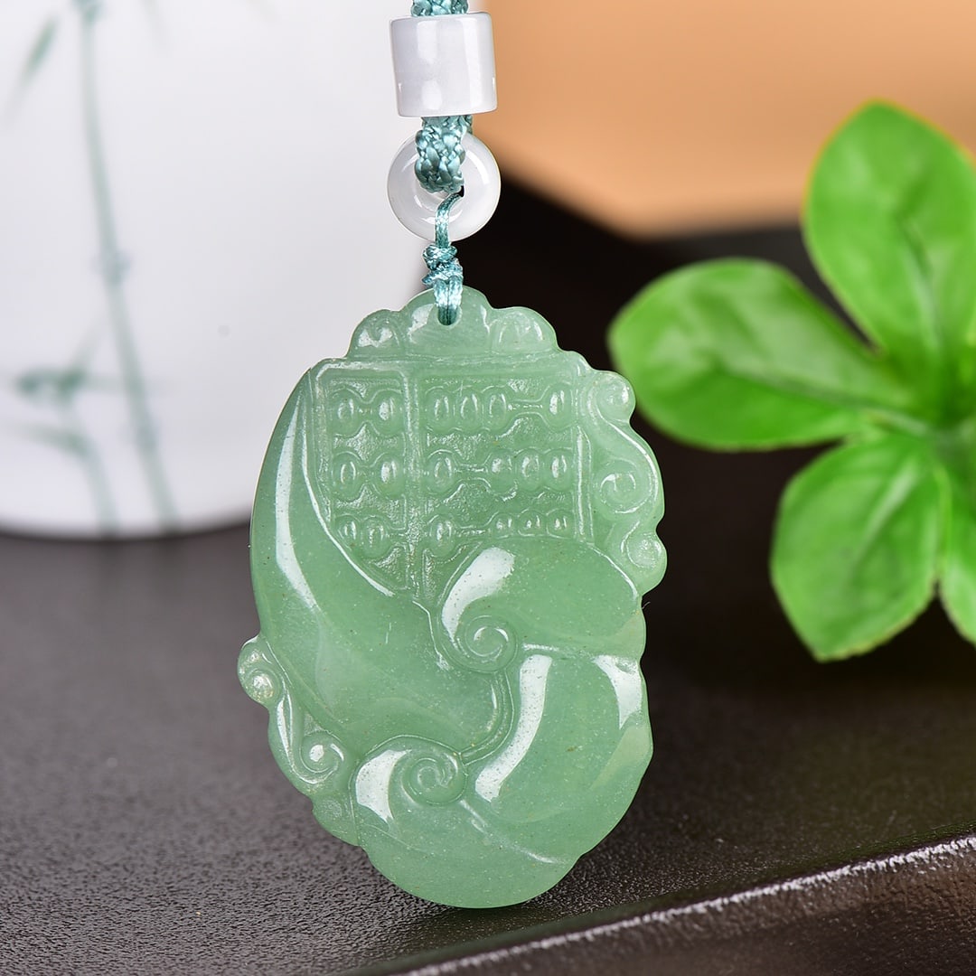 An Exquisite Greenish Jade Pendant (1 of 4)