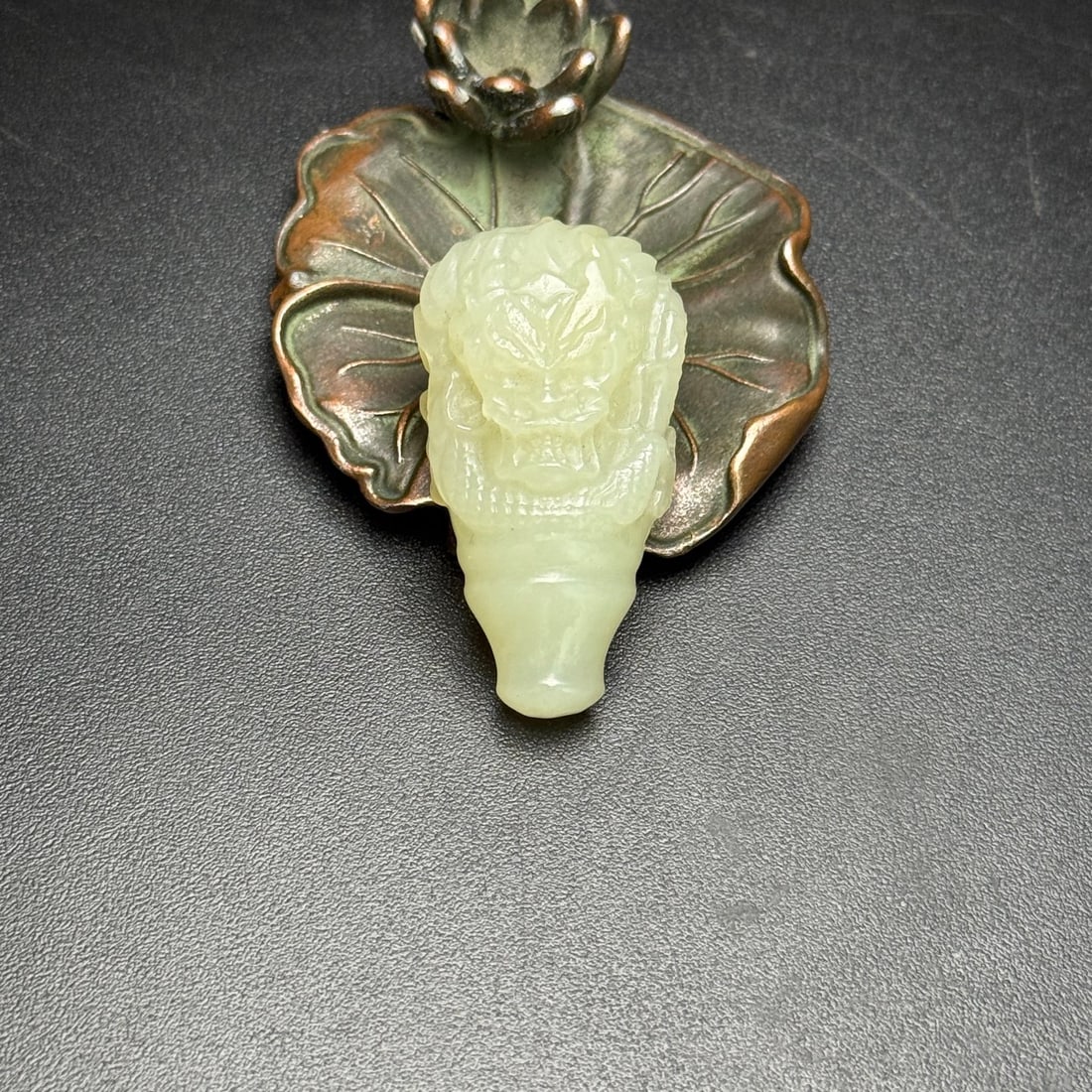 A Exquisite Hotan Jade Dragon Head Accessory: A Exquisite Hotan Jade Dragon Head Accessory,Qing Dynasty, China,Size:1.6inx0.9inx0.7in,Weight:19g 和田玉龙头配饰,中国清代