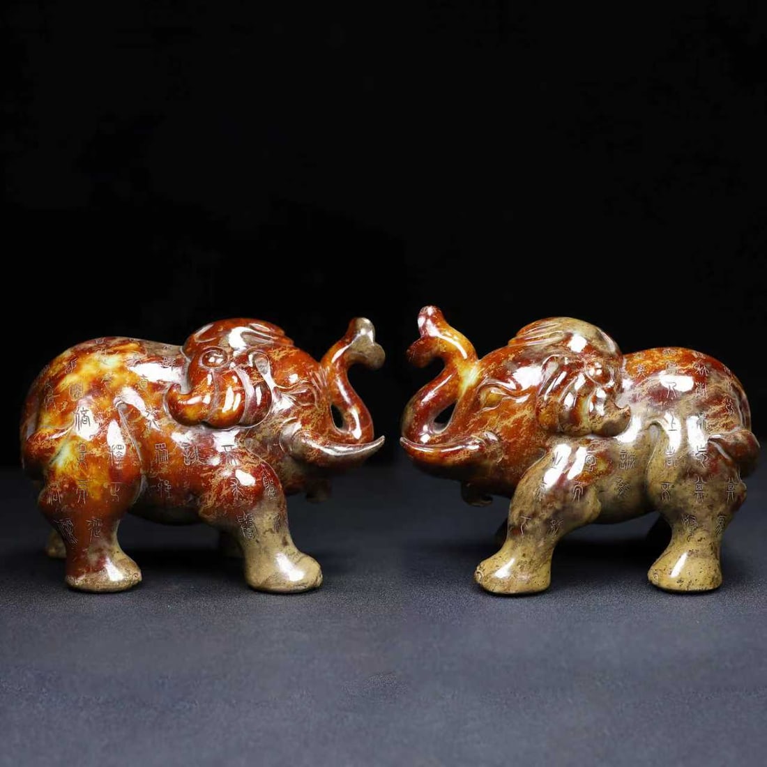 A pair of Exquisite Hotan Jade Elephant Ornament: A pair of Exquisite Hotan Jade Elephant Ornament,Han Dynasty, China,Size:7.1inx4.7inx5.5in,Weight:5749g