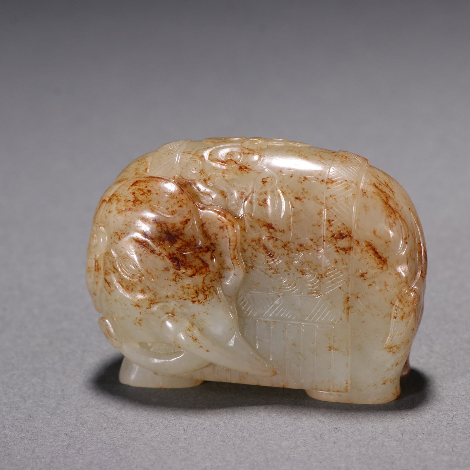 A Exquisite Hotan Jade Elephant Ornament: A Exquisite Hotan Jade Elephant Ornament,Qing Dynasty, China,Size:1.5inx2.1inx0.9in(Thickness) 和田玉象摆件,中国清代