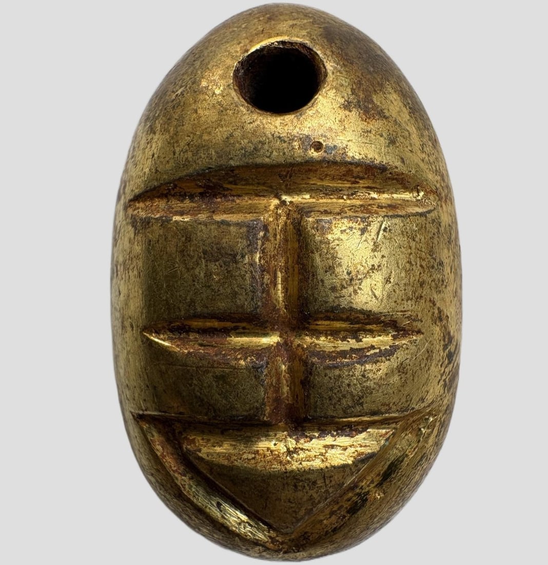 A Exquisite Gilt Bronze Coin: A Exquisite Gilt Bronze Coin,Han Dynasty, China,Size:1.1inx0.7in,Weight:21.6g 铜鎏金鬼脸金钱,中国汉代