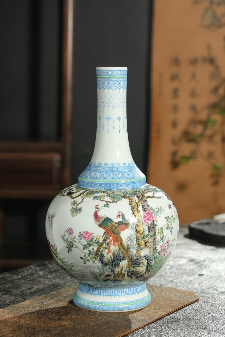 A Exquisite Famille-Rose Flower and Bird Pattern Vase: A Exquisite Famille-Rose Flower and Bird Pattern Vase,Qing Dynasty, China,Qianlong Six-character Mark,Size:13inx1.7inx7.1inx6.3in