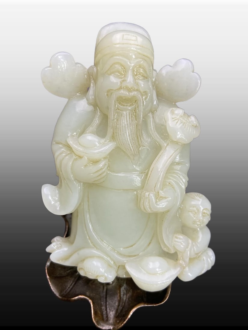 A Exquisite Hotan Jade Mammon Ornament: A Exquisite Hotan Jade Mammon Ornament,Ming Dynasty, China,Size:3.5inx2.7inx1.4in,Weight:213g 和田玉财神摆件,中国明代