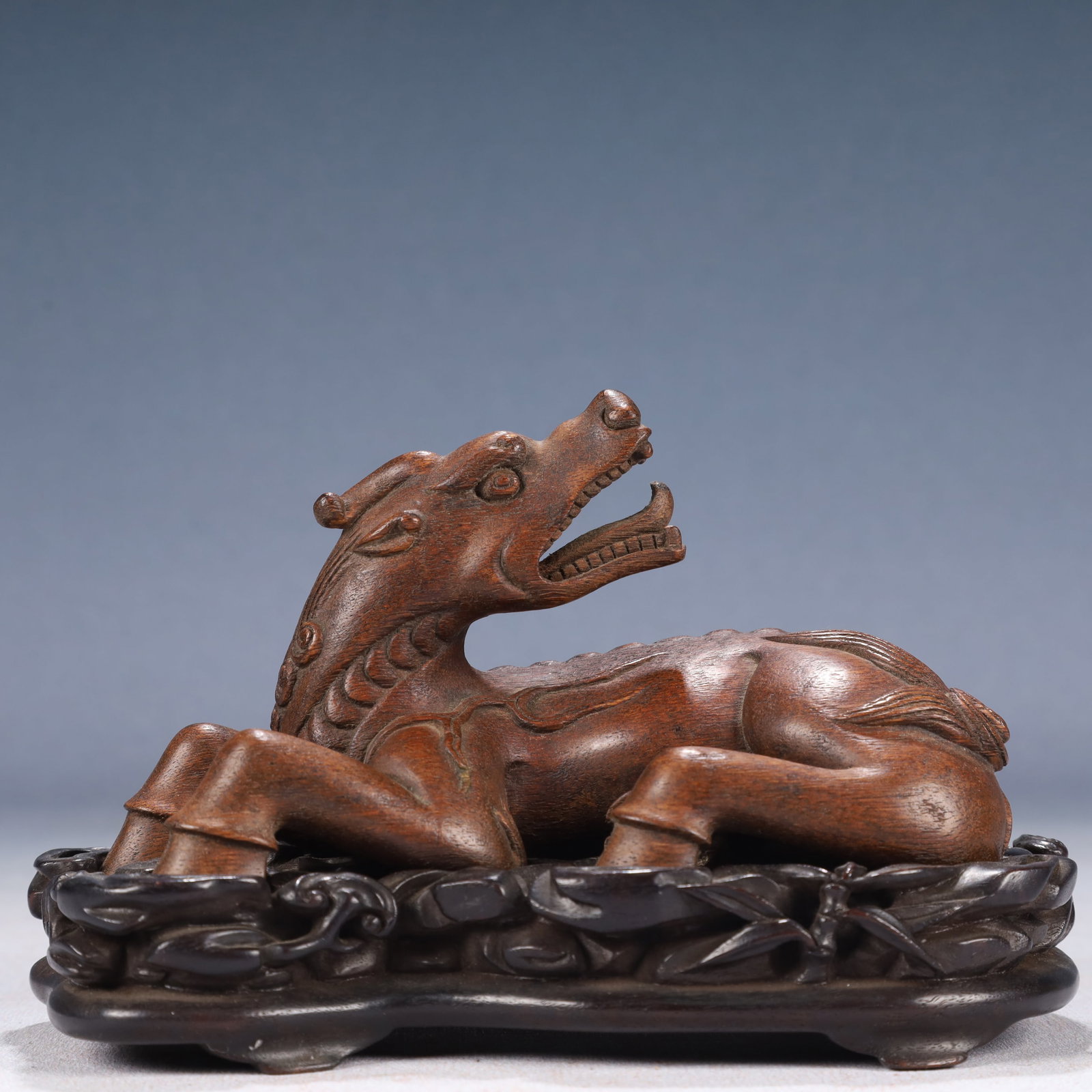 An Exquisite Zitanwood Auspicious Beast Ornament,With Base: An Exquisite Zitanwood Auspicious Beast Ornament,With Base,Qing Dynasty, China,Size:5.1inx3inx3.9in,Weight:300g 紫檀木瑞兽摆件,带底座,ߑ