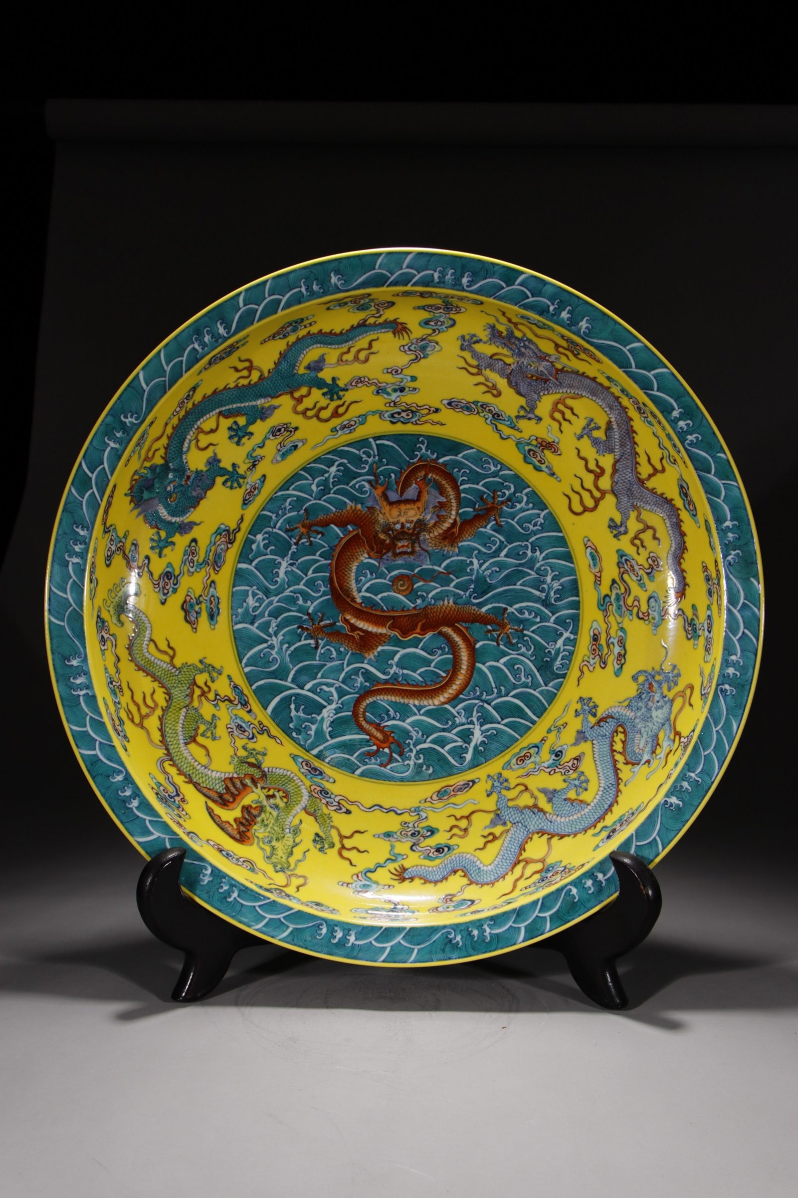 A Huge Yellow Ground Doucai Seawater Auspicious Cloud and Dragon Pattern Plate: A Huge Yellow Ground Doucai Seawater Auspicious Cloud and Dragon Pattern Plate,Qing Dynasty,China,Qianlong Six-character Mark,Size:3.1inx19.9in 黄地斗彩海水祥