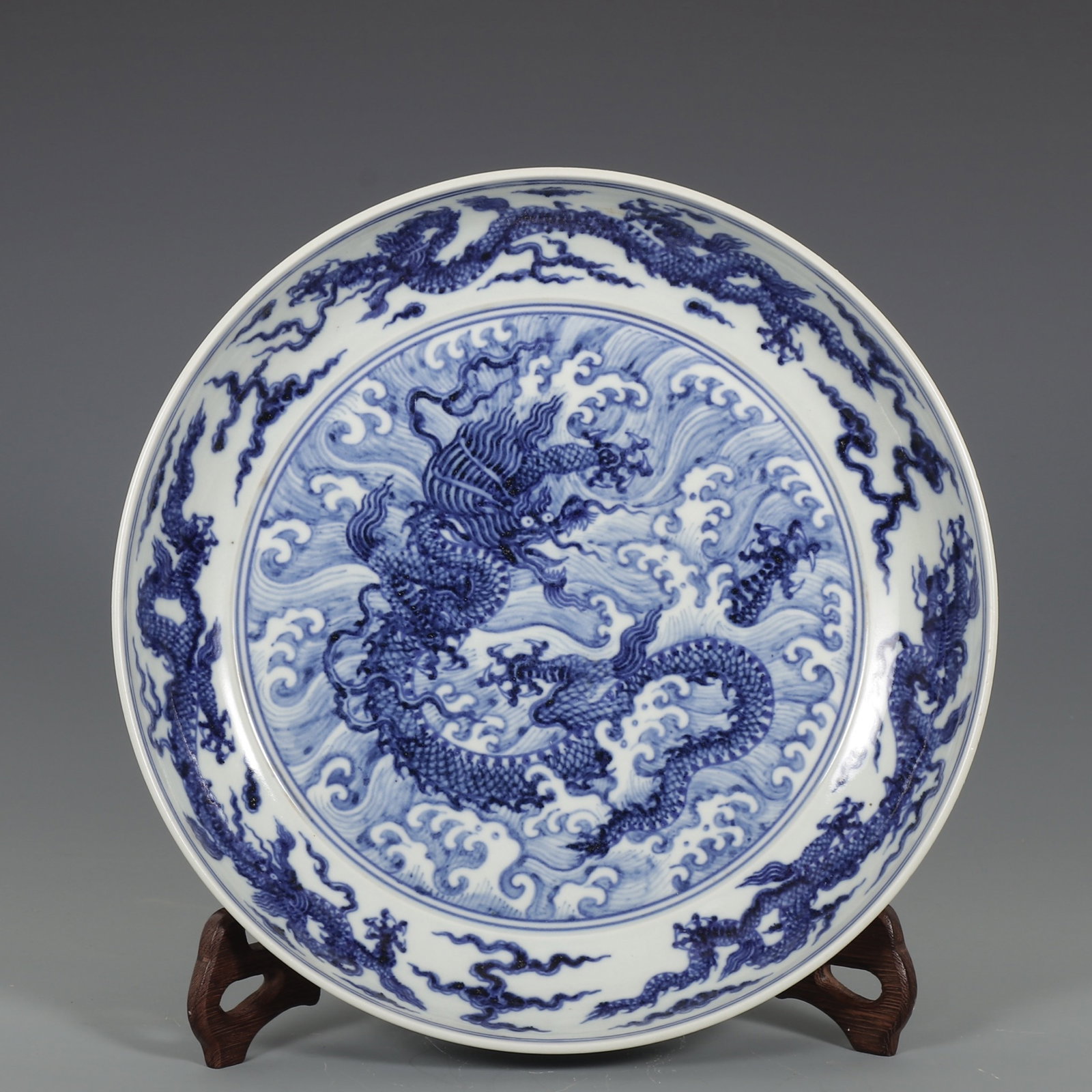 A Rare Blue and White Seawater and Dragon Pattern Plate: A Rare Blue and White Seawater and Dragon Pattern Plate,Ming Dynasty,China,Xuande Six-character Mark,Size:2.4inx12.2in 青花海水龙纹盘子,中国