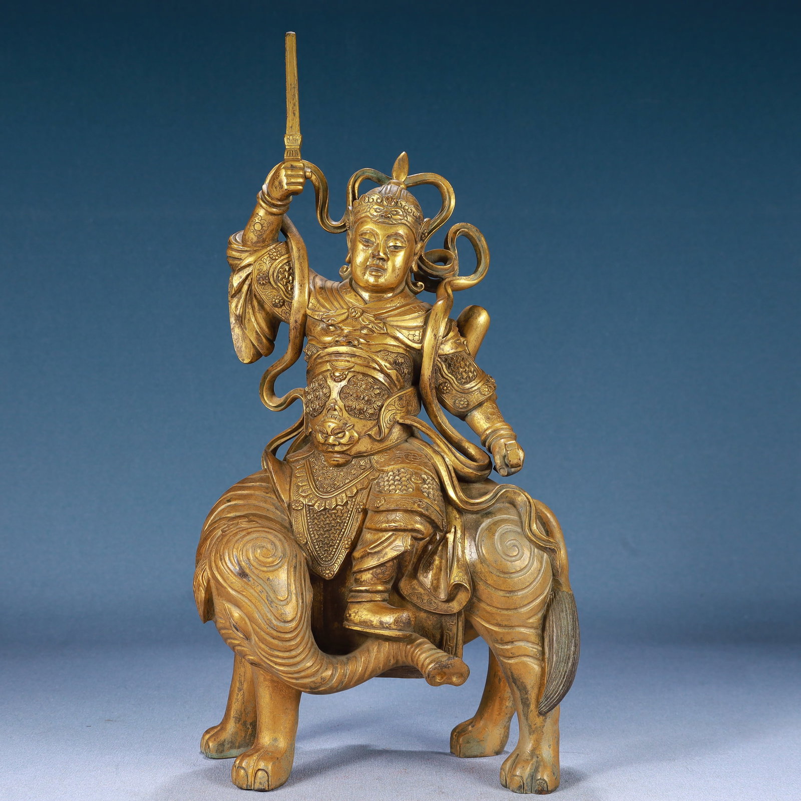 A Solemn Gilt Bronze Statue of Dharma Protector Rides the Elephant: A Solemn Gilt Bronze Statue of Dharma Protector Rides the Elephant,Qing Dynasty, China,Size:7.1inx3.9inx14.6in,Weight:6000g 铜鎏金骑象护法像,中