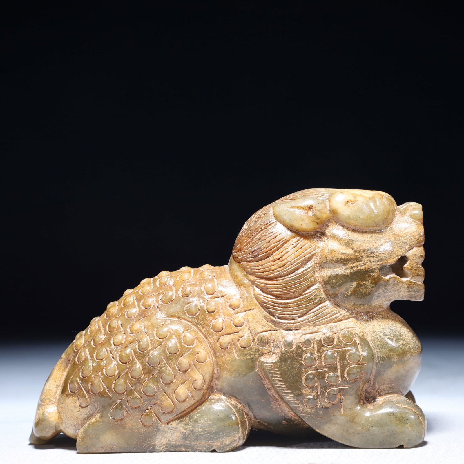An Exquisite Green Jade Auspicious Beast Ornament: An Exquisite Green Jade Auspicious Beast Ornament,Qing Dynasty,China,Size:5.1inx1.8inx3.3in,Weight:900g 青玉瑞兽摆件,中国清代