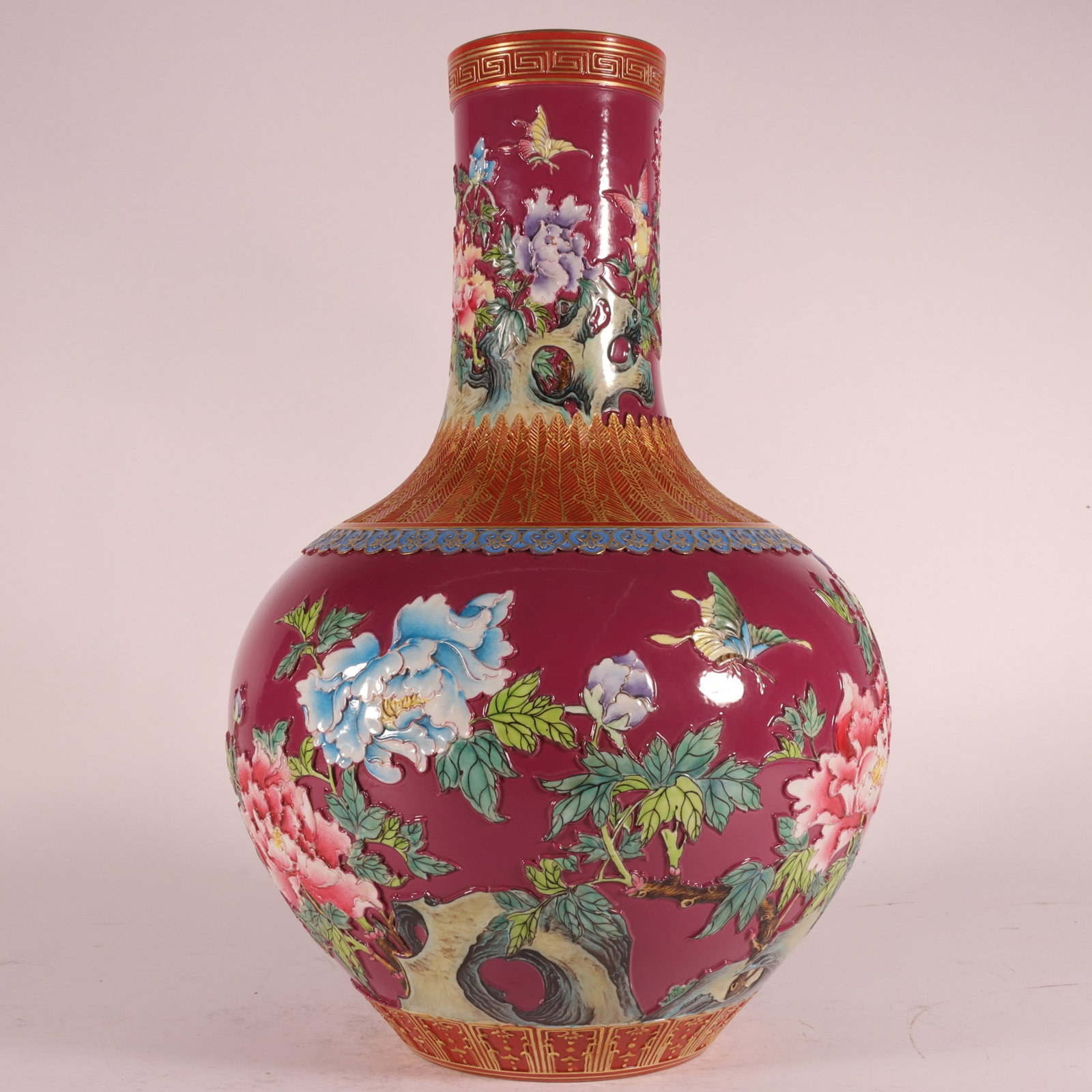 A Rare Enamel Ruby Red-Glazed Flower and Butterfly Pattern Vase: A Rare Enamel Ruby Red-Glazed Flower and Butterfly Pattern Vase,Qing Dynasty,China,Qianlong Six-character Mark,Size:13inx8.3in 珐琅彩胭脂红花卉蝴&