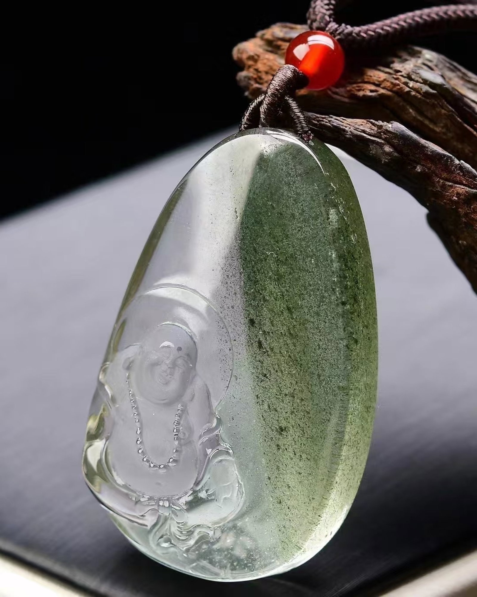 An Exquisite Crystal Statue of Maitreya Buddha Pattern Pendant: An Exquisite Crystal Statue of Maitreya Buddha Pattern Pendant,Size:48mmx30mmx13mm,Weight:33g 水晶弥勒佛像纹吊坠