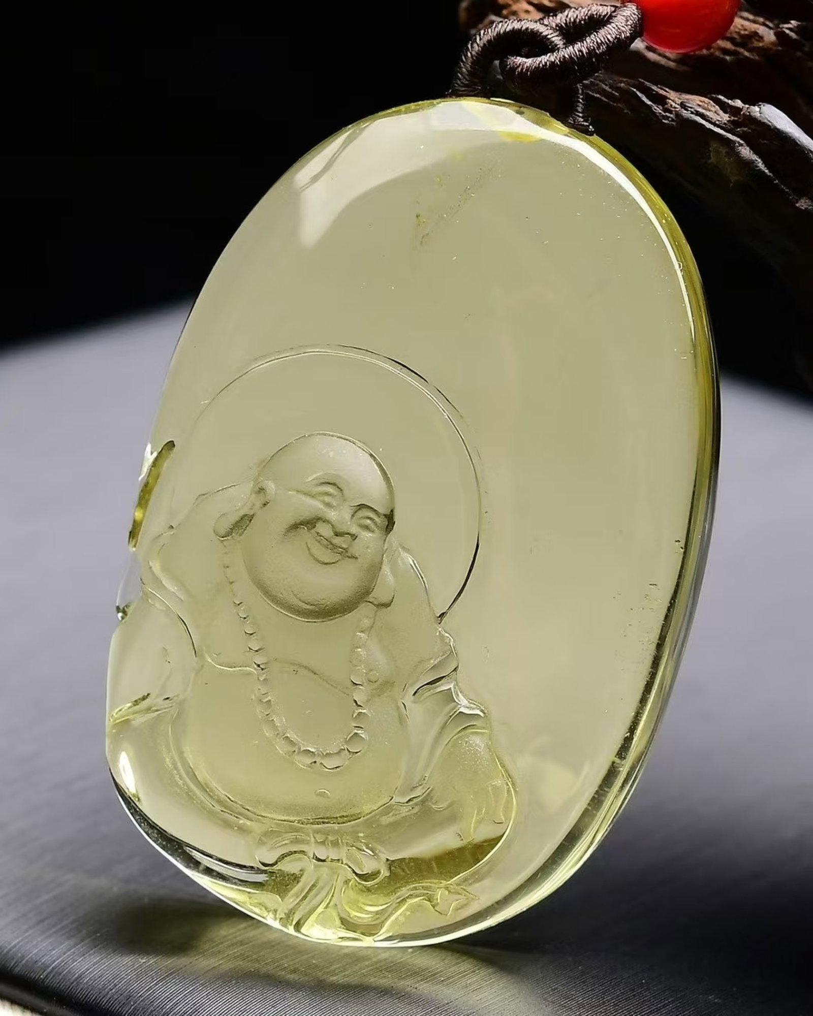 An Exquisite Crystal Statue of Maitreya Buddha Pattern Pendant: An Exquisite Crystal Statue of Maitreya Buddha Pattern Pendant,Size:44mmx29mmx13mm,Weight:29g 水晶弥勒佛像纹吊坠